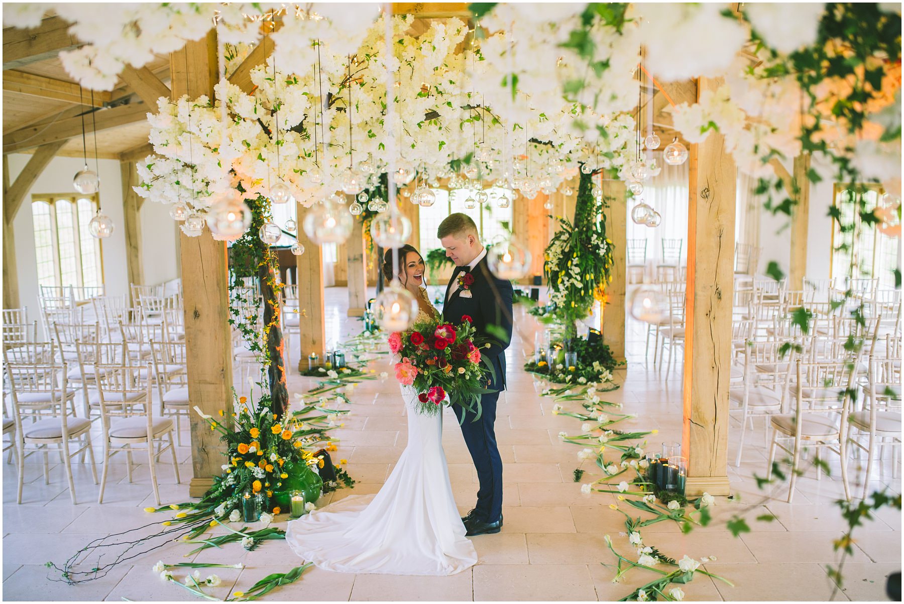 Inside the ceremony room at Colshaw Hall decorated by Red Floral Architecture