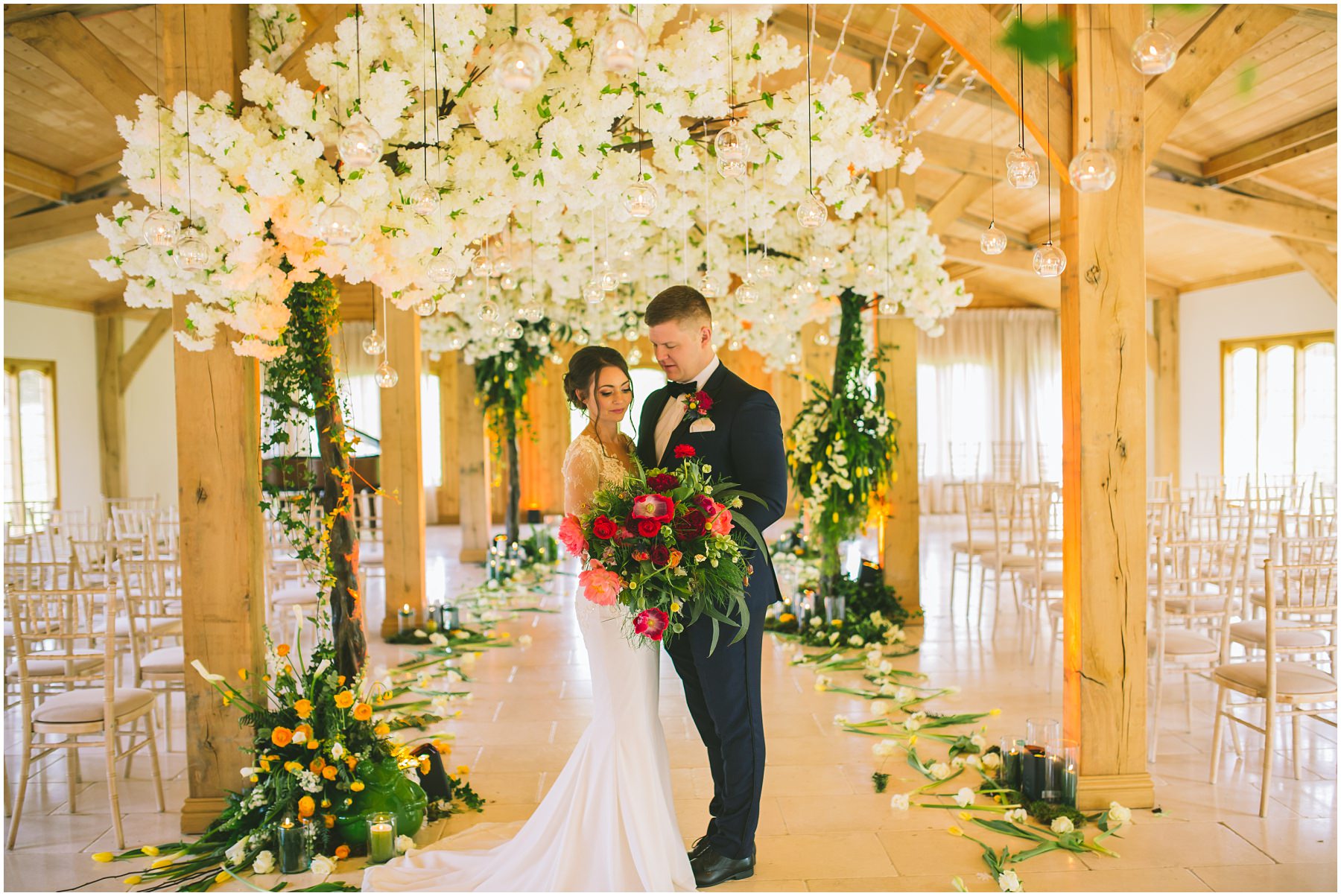 Inside the ceremony room at Colshaw Hall decorated by Red Floral Architecture
