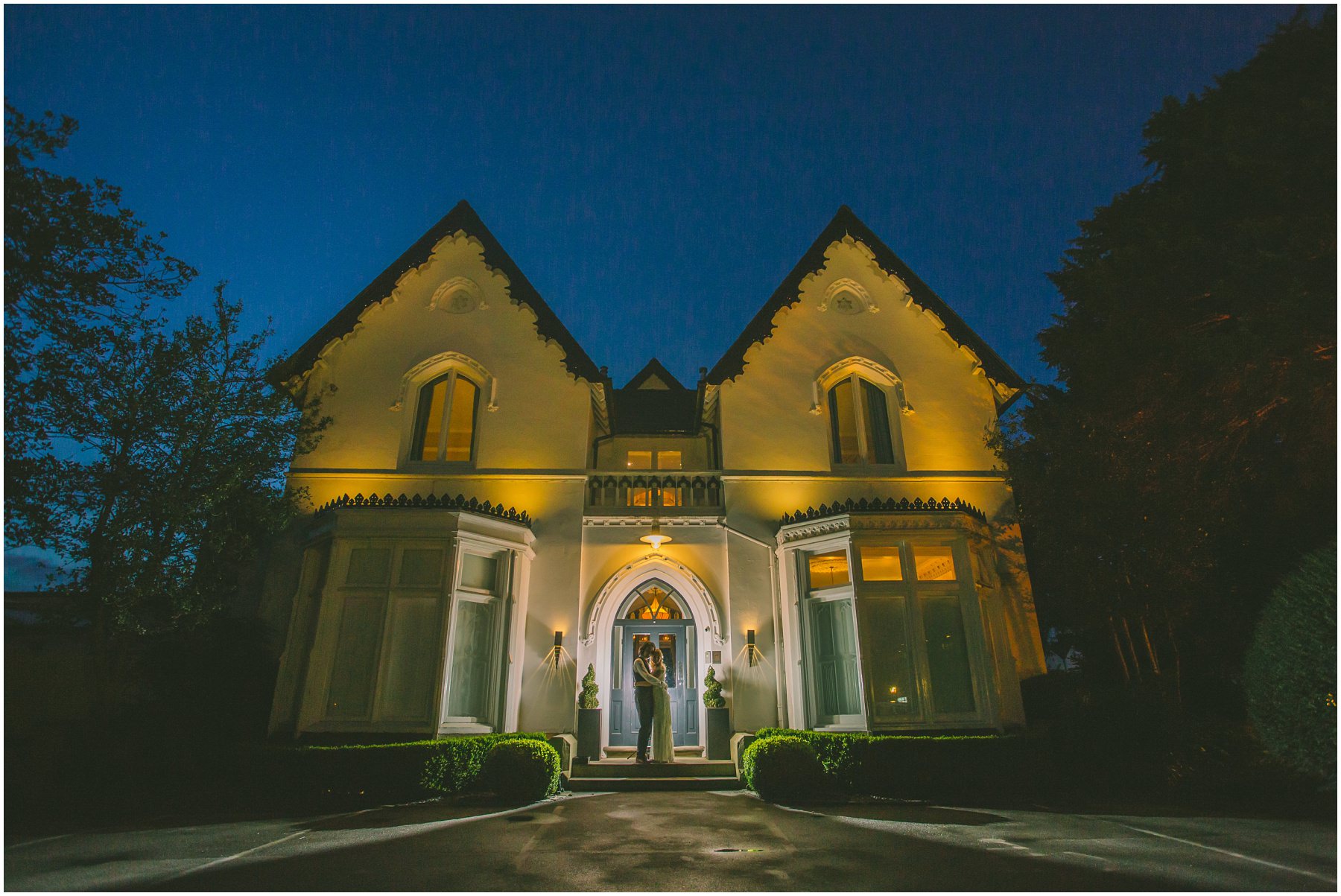 Final bride and groom portrait in front of the stunning Victorian villa at Didsbury House Hotel