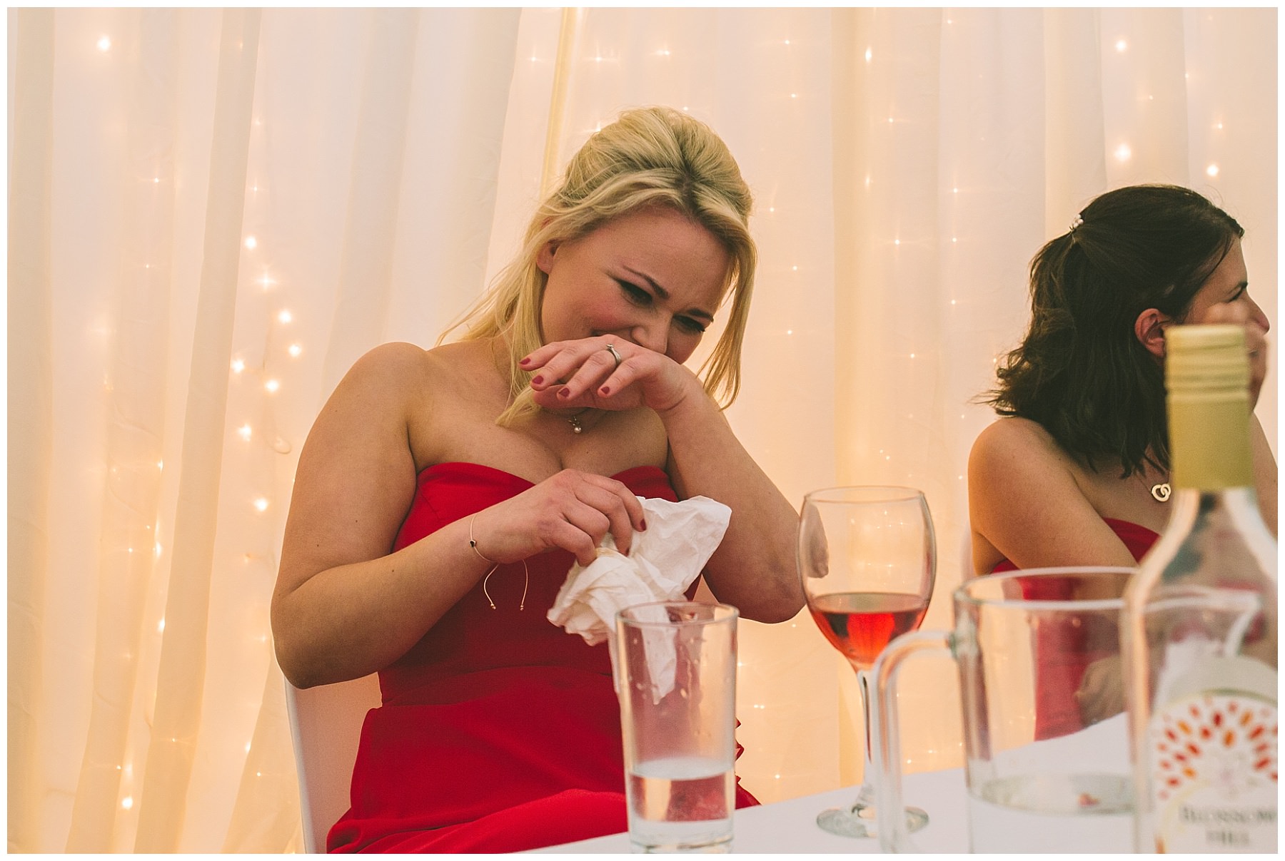 A bridesmaid nearly spits her drink out during speeches at Pentre Mawr