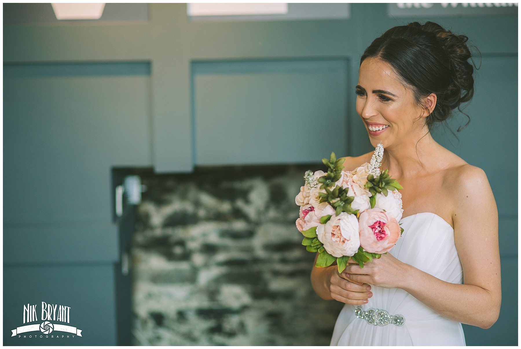 Bride to be smiles as she sees her bride for the first time