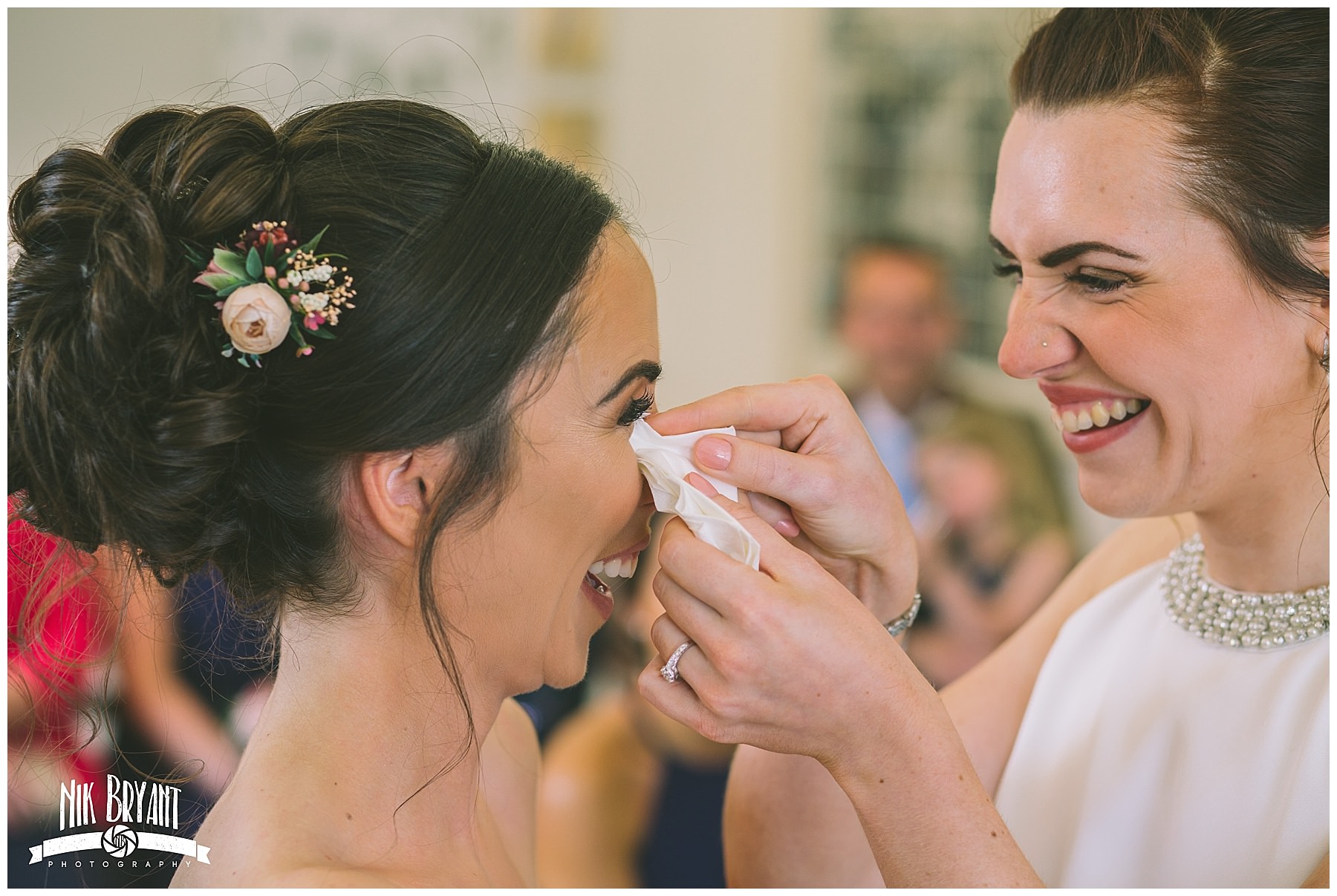 bride wipes a tear from her wifes eye during Lancashire Wedding