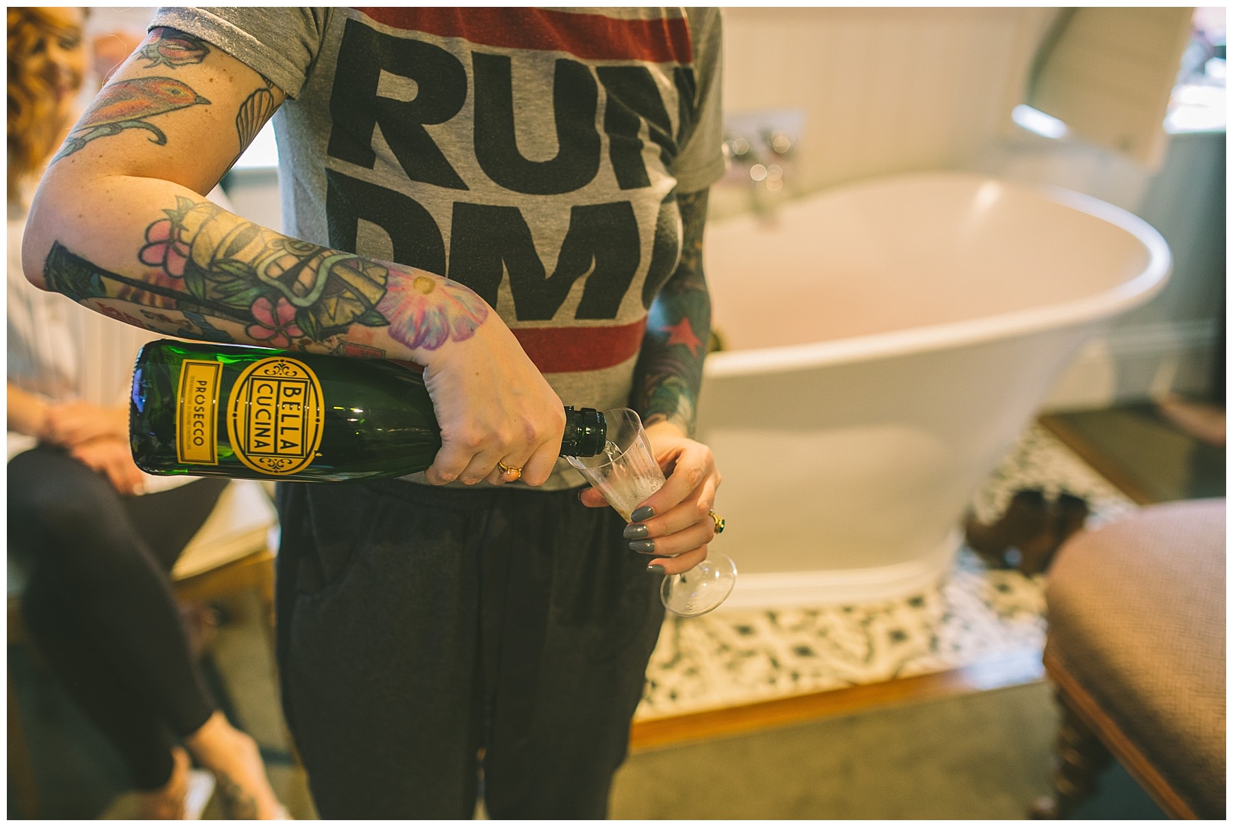 bridesmaid pours champagne