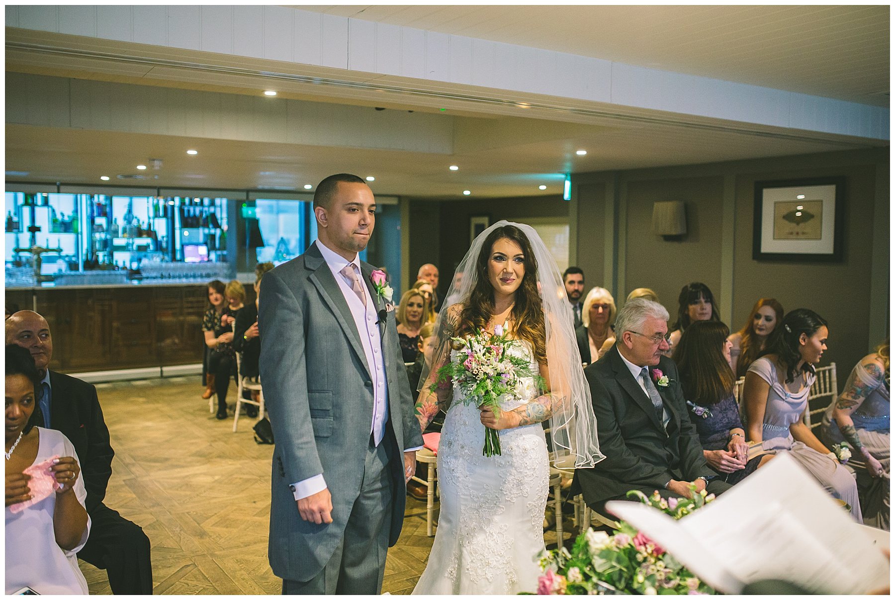 bride and groom during ceremony at manchester wedding