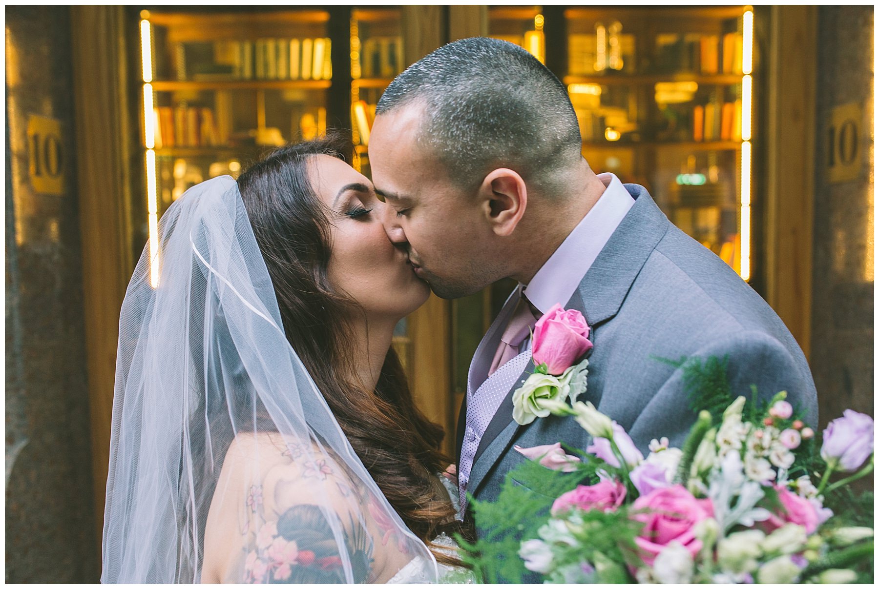 bride and groom kiss outside king street townhouse