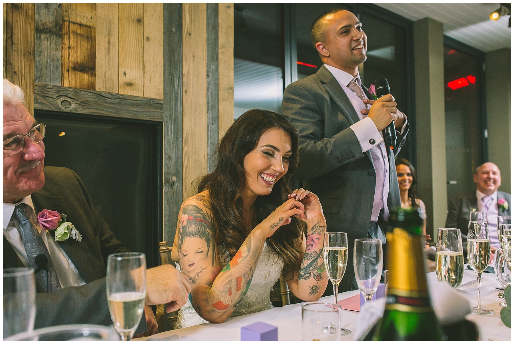 Bride laughs at grooms speech