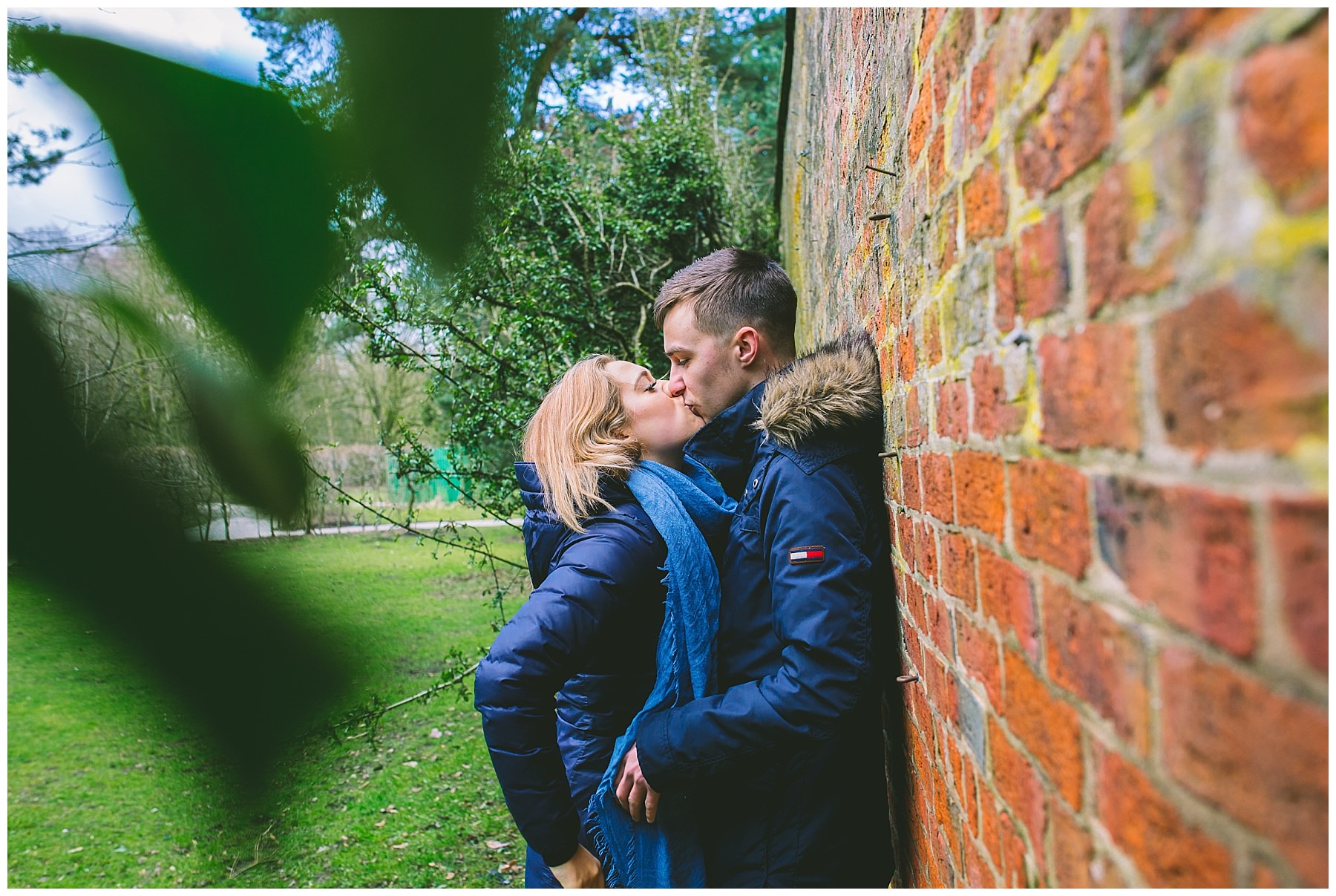 Couple share a kiss during engagement shoot