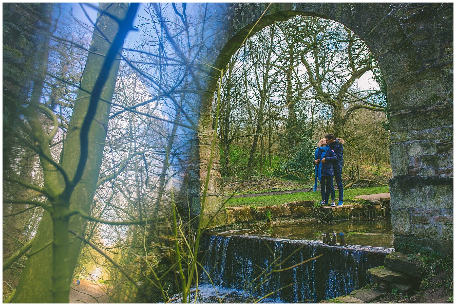 Preston couple share a kiss under an archway