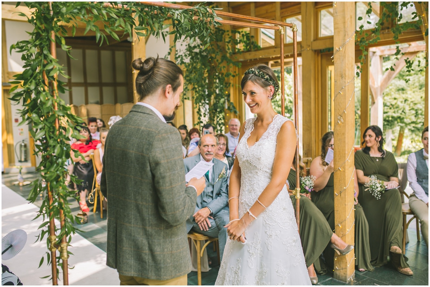 Groom reads his vows to his bride during wedding ceremony