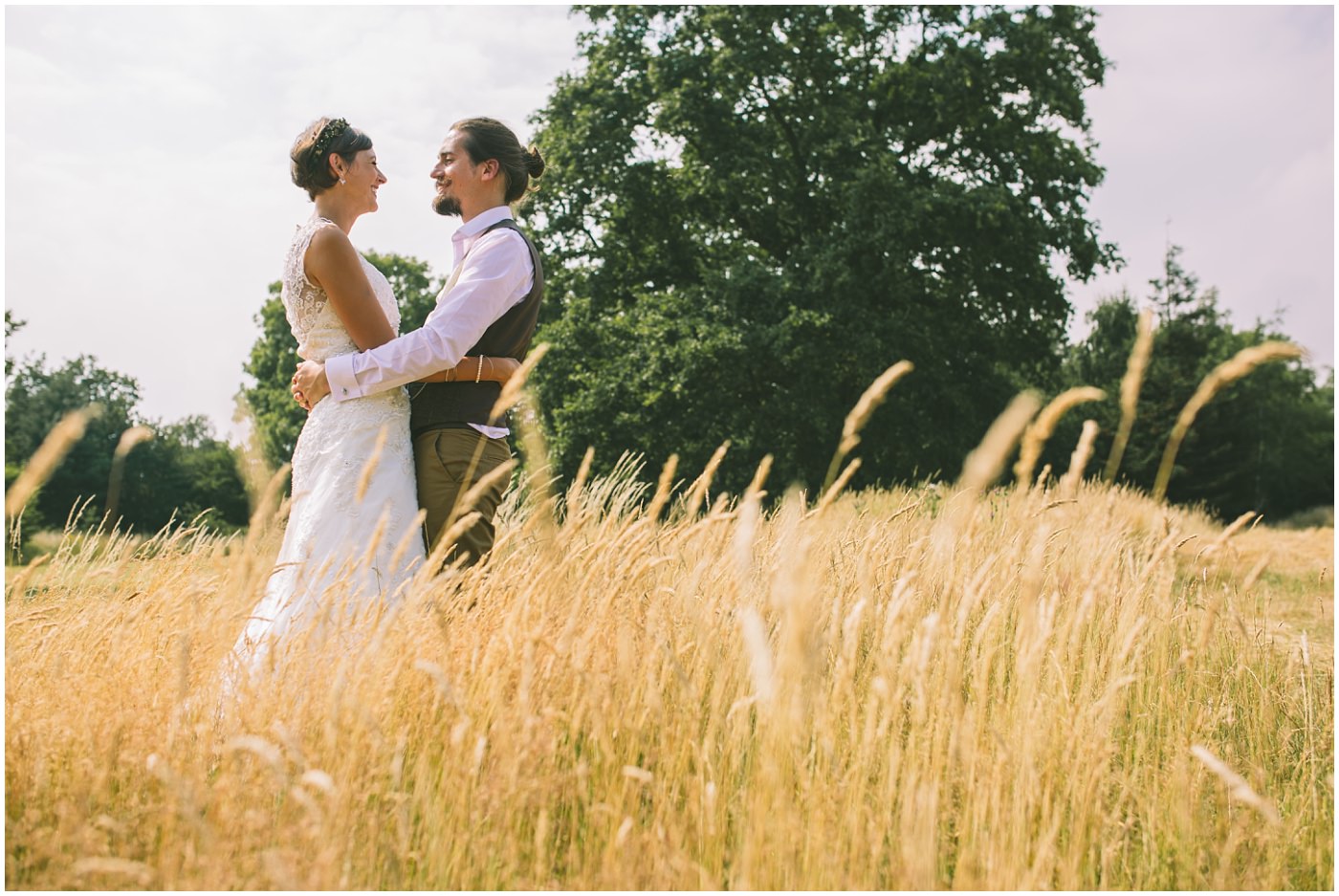 bridal portraits in golden fields of wheat