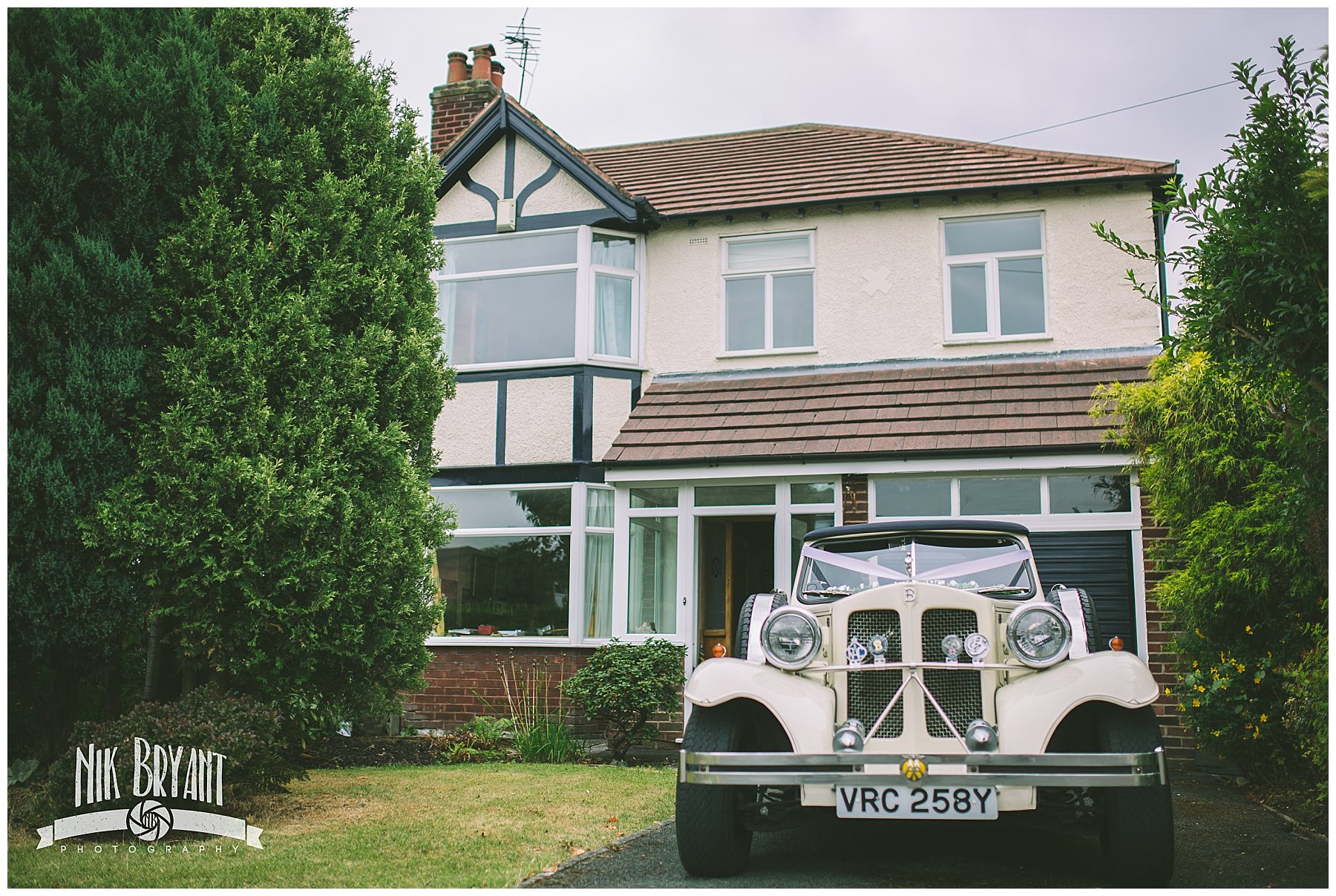 Wedding car parked on the drive of brides house