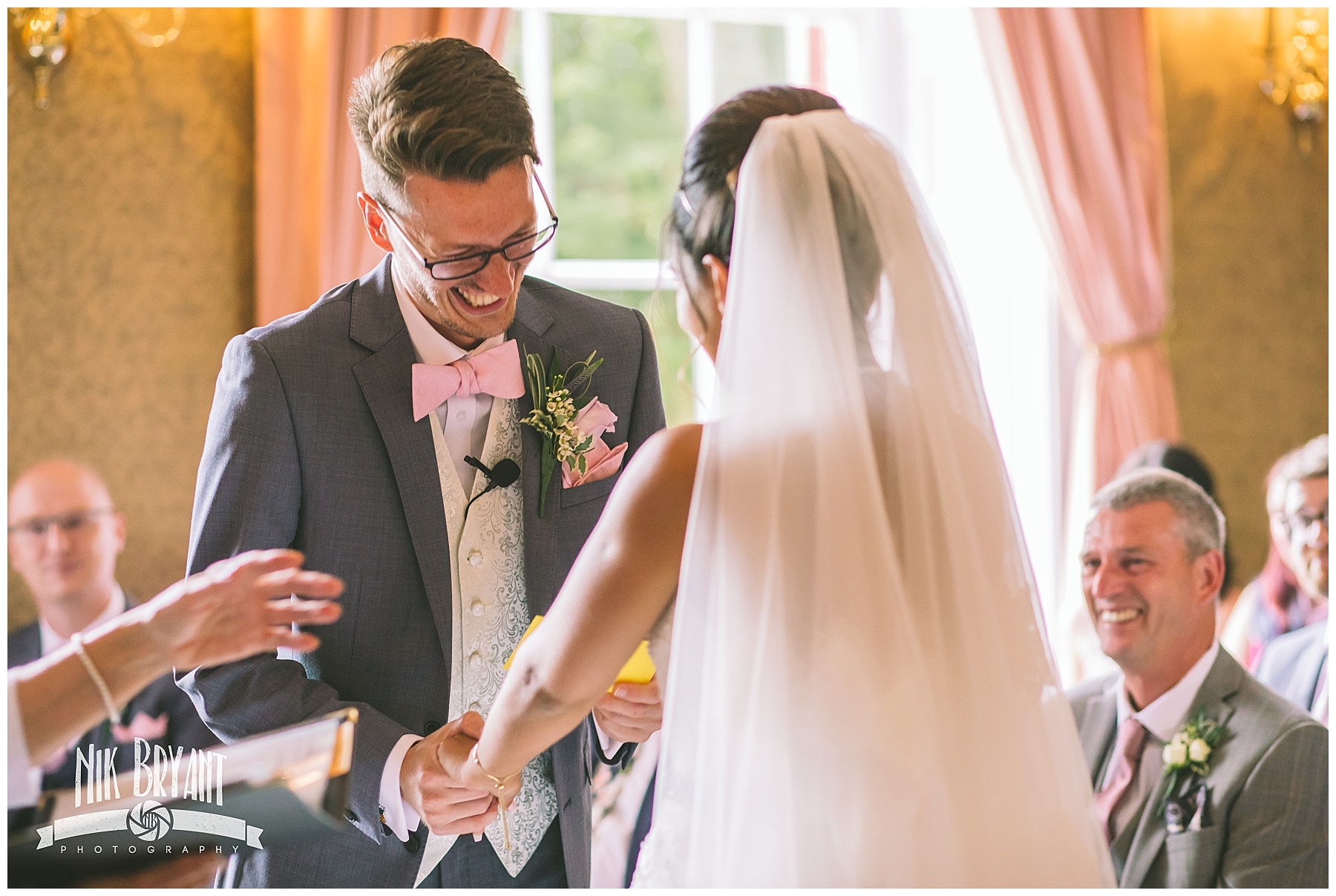 groom laughs during shrigley hall wedding