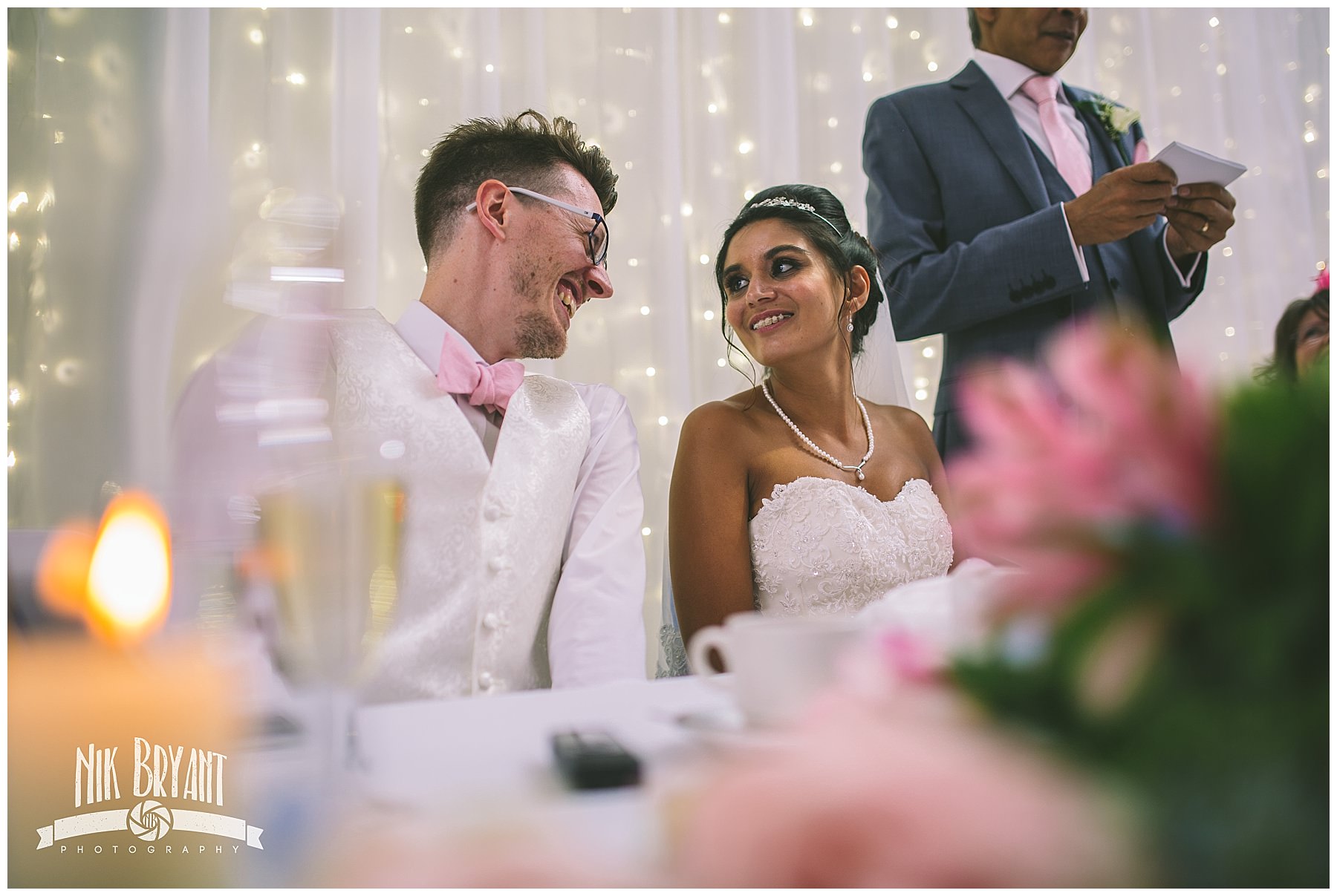 Bride and Groom Share a moment during father of the brides speech