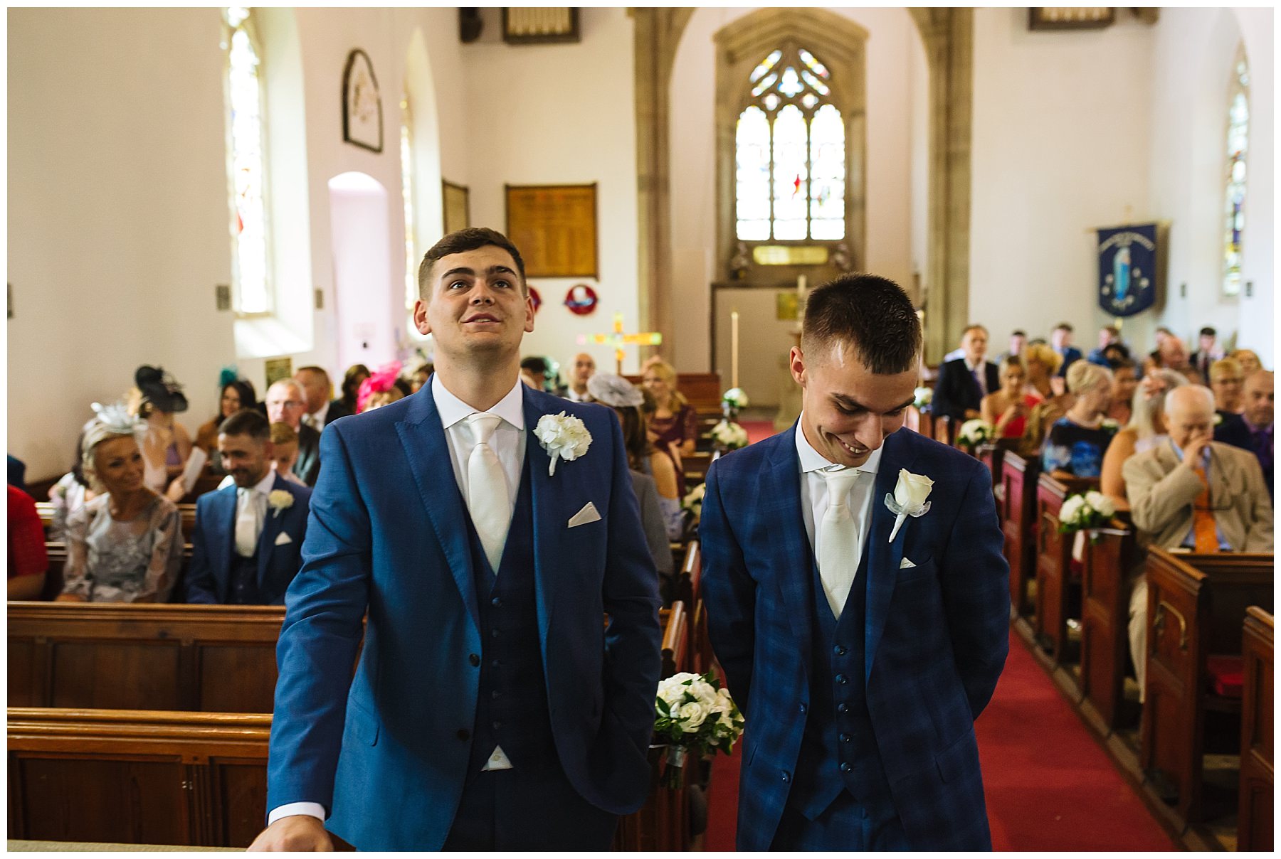 groom and best man in blue check suits in church