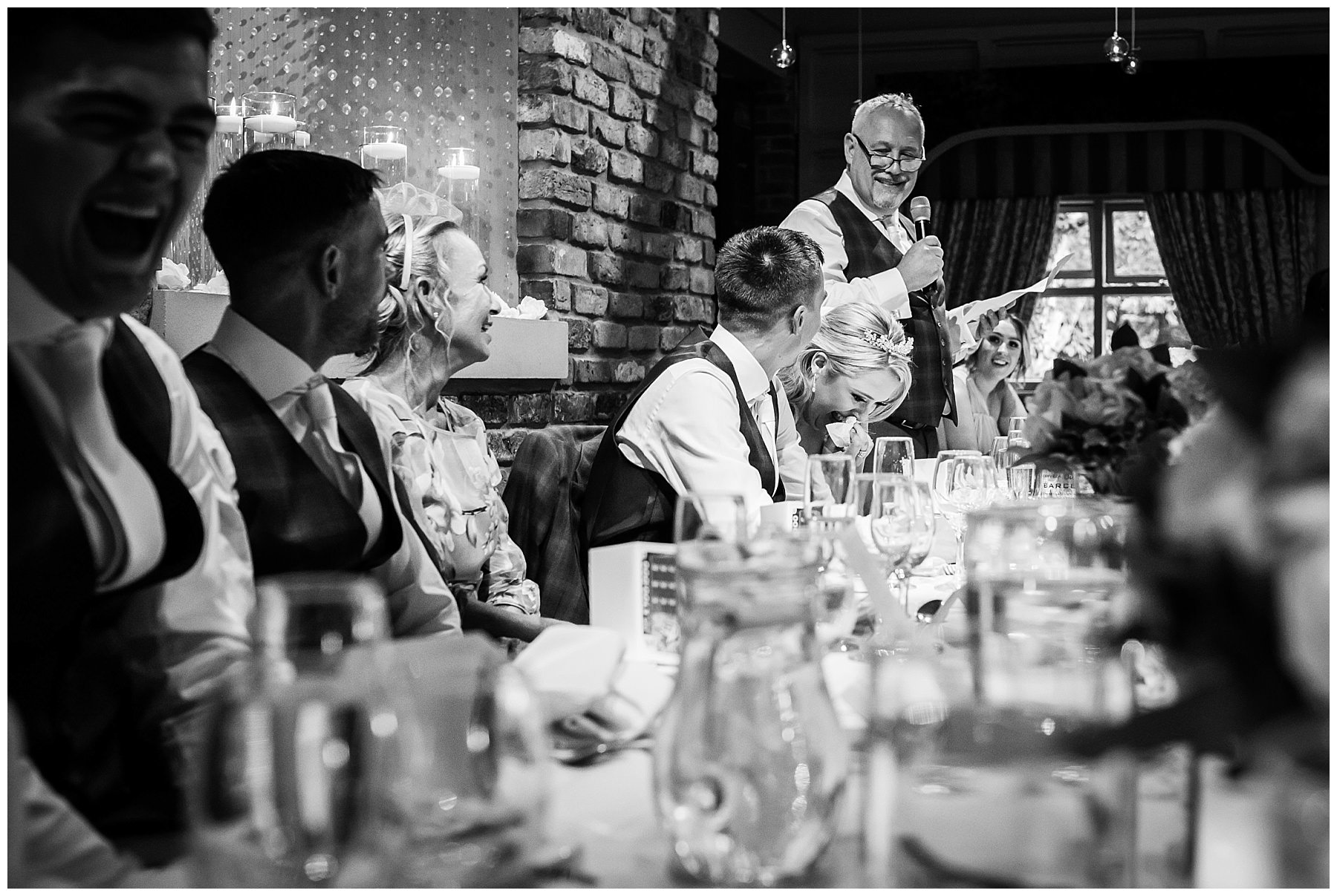 top table reacts to speech by father of the bride at Bartle Hall