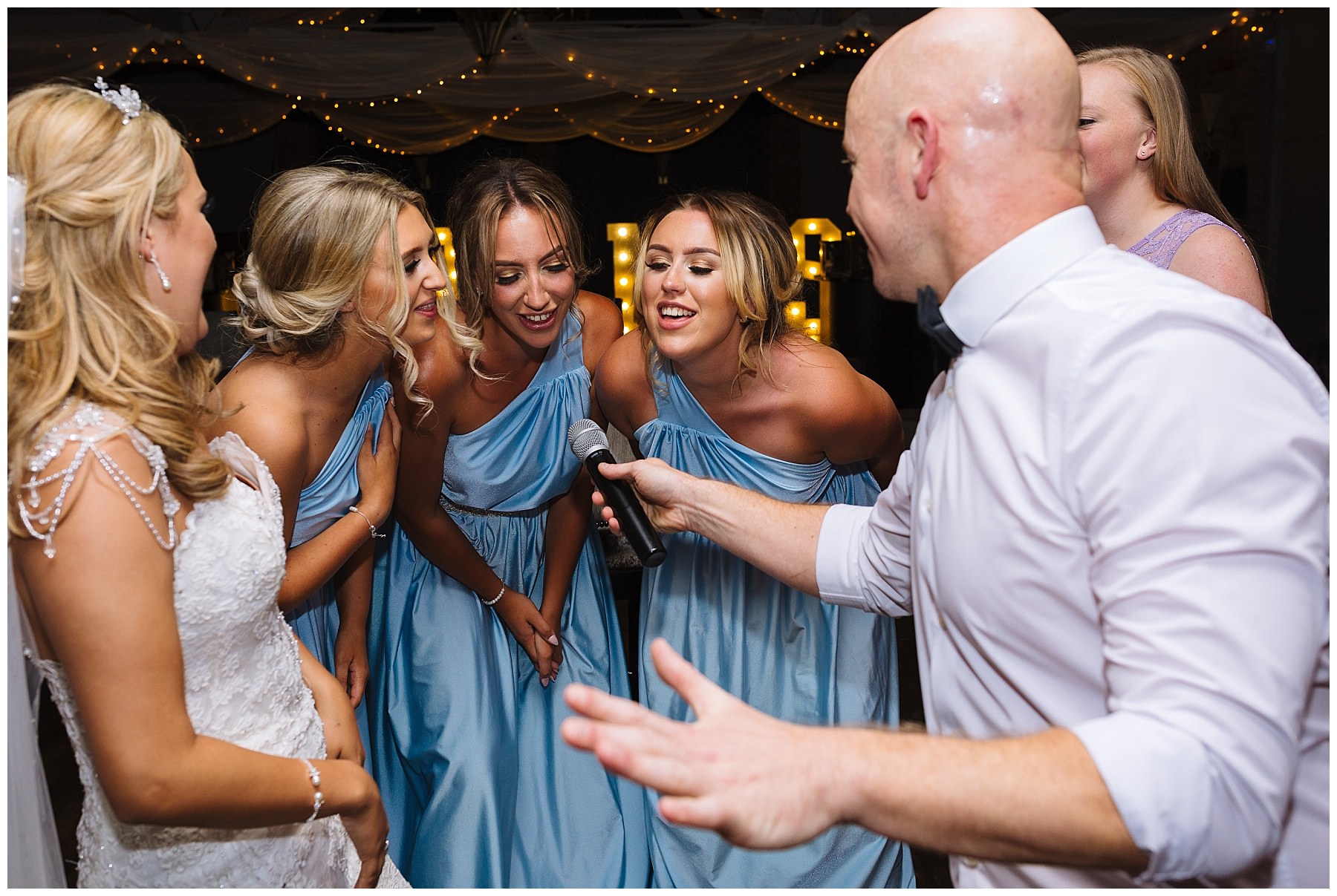 Bridal party singing with Wayne Farrow