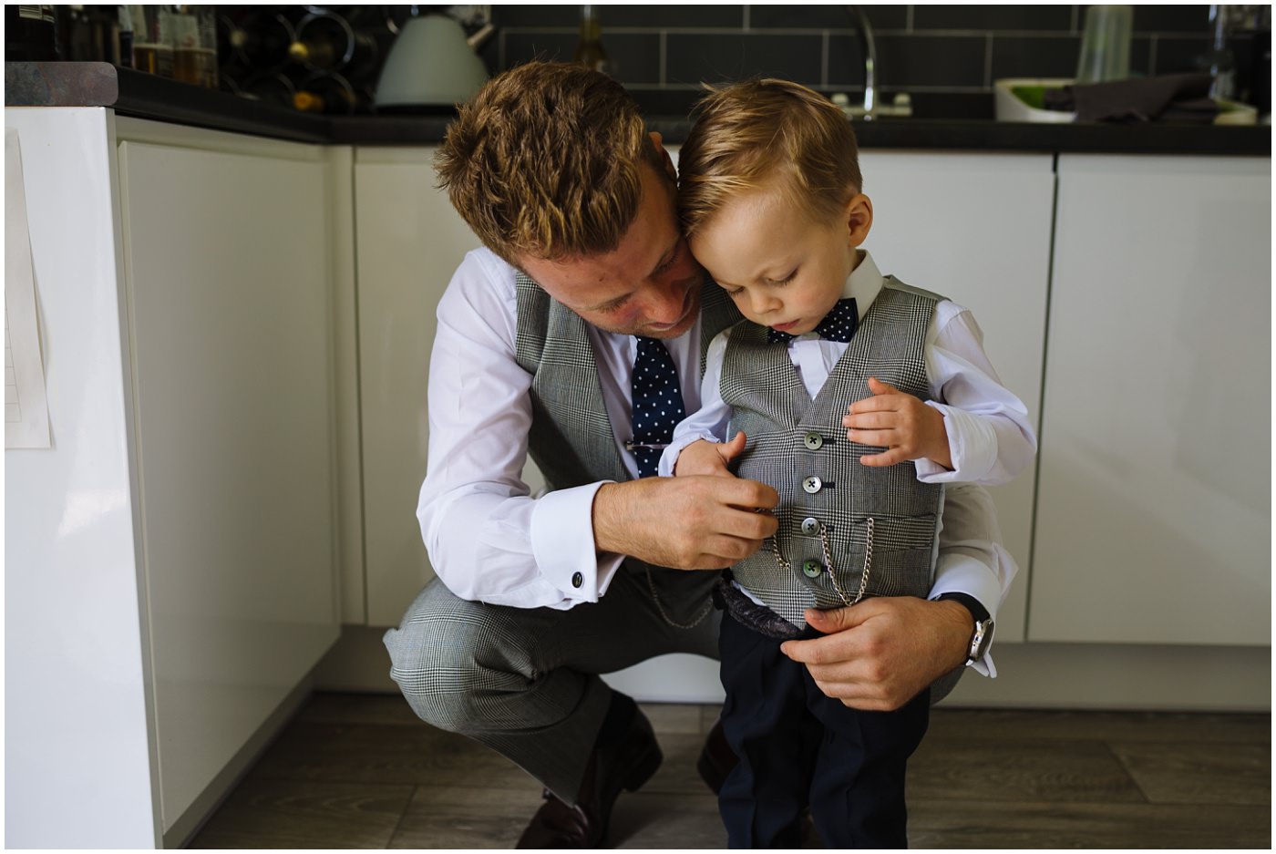 Groom and son in matching whitfied and ward suits