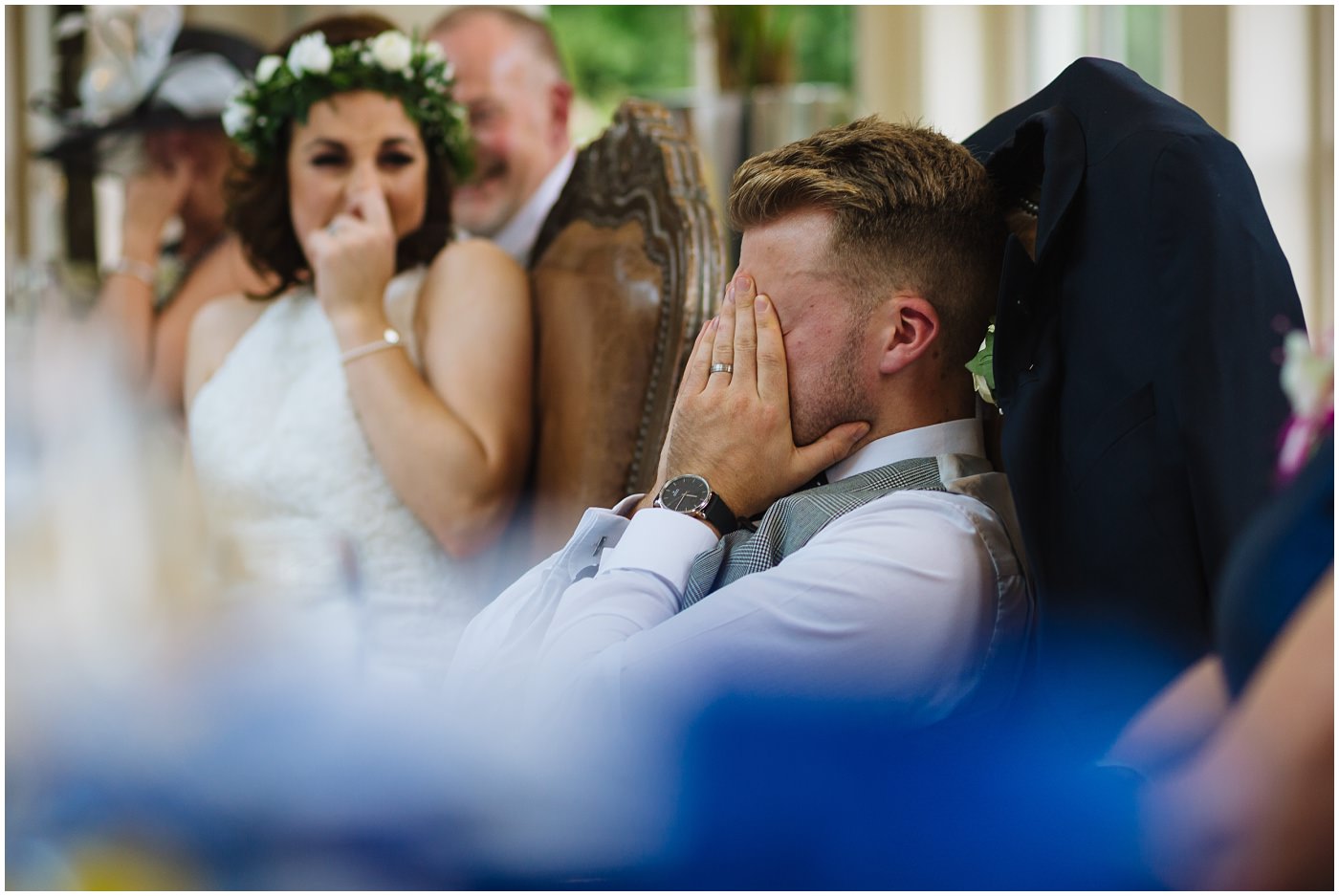 groom is embarrassed by best man
