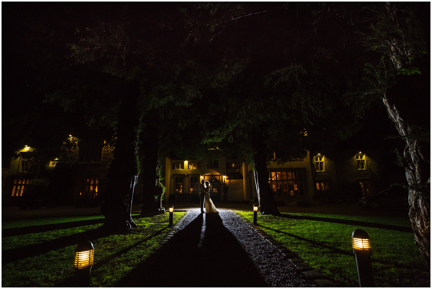 Married couple silhouette outside Mitton Hall