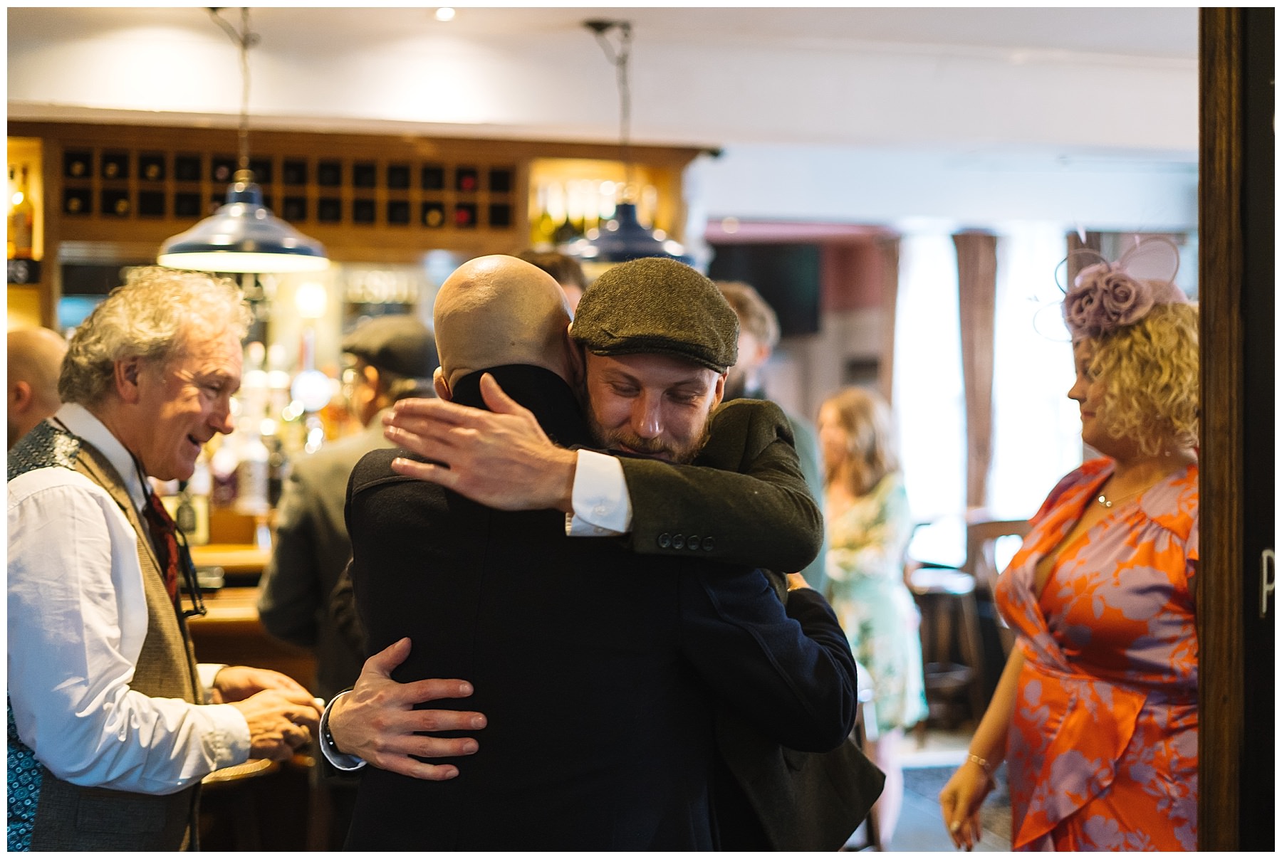 hugs in the pub on wedding morning