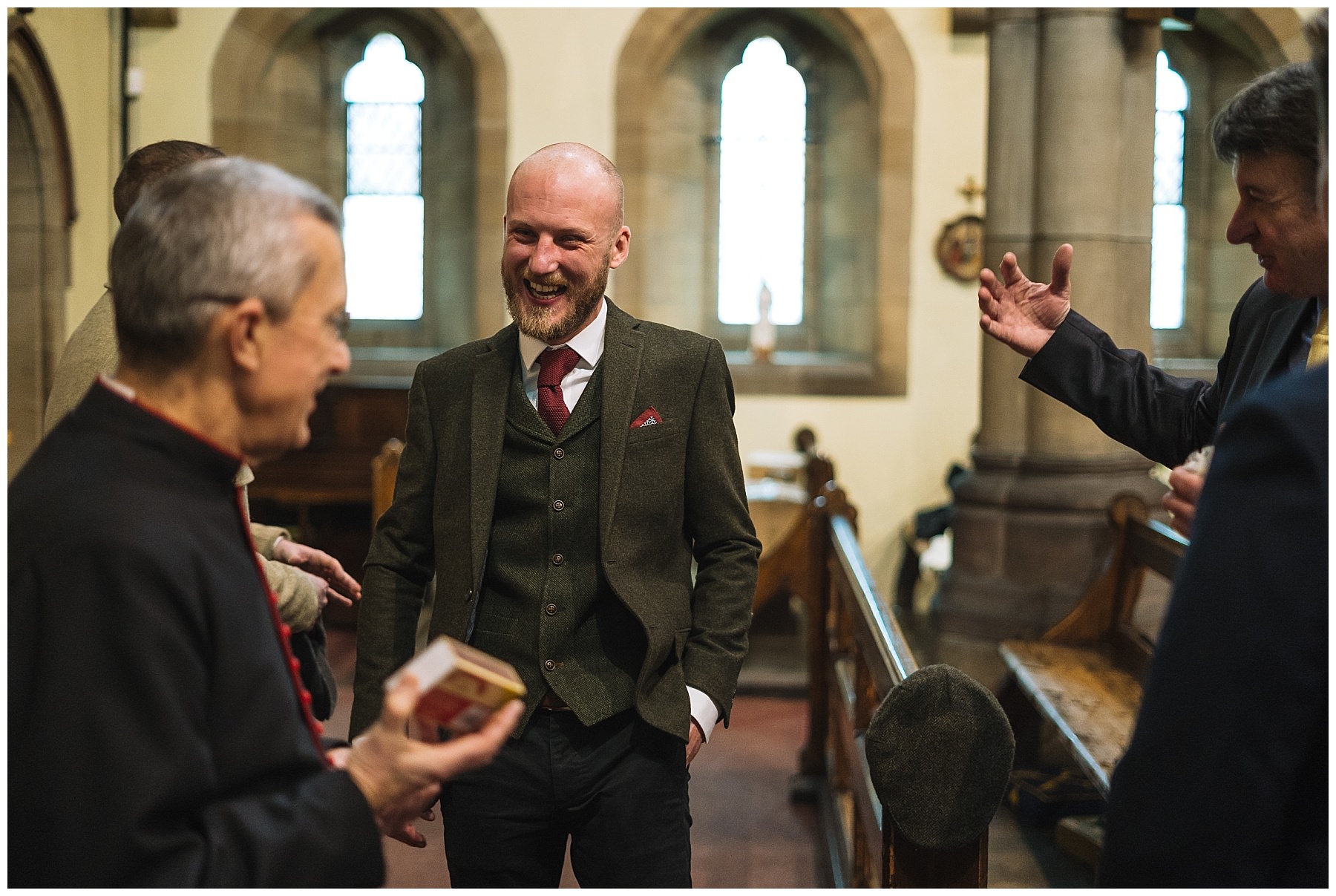 groom laughing before church service