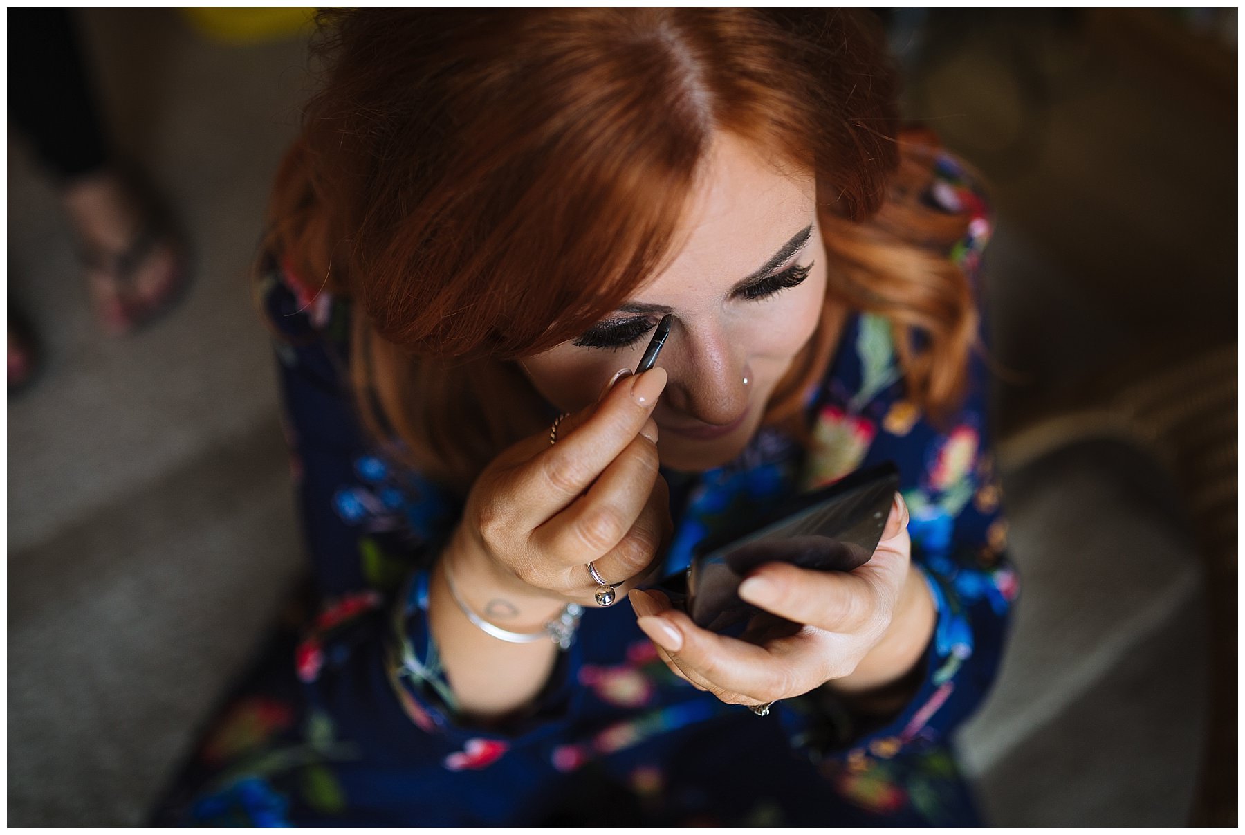 Bride applies finishing touches to make up