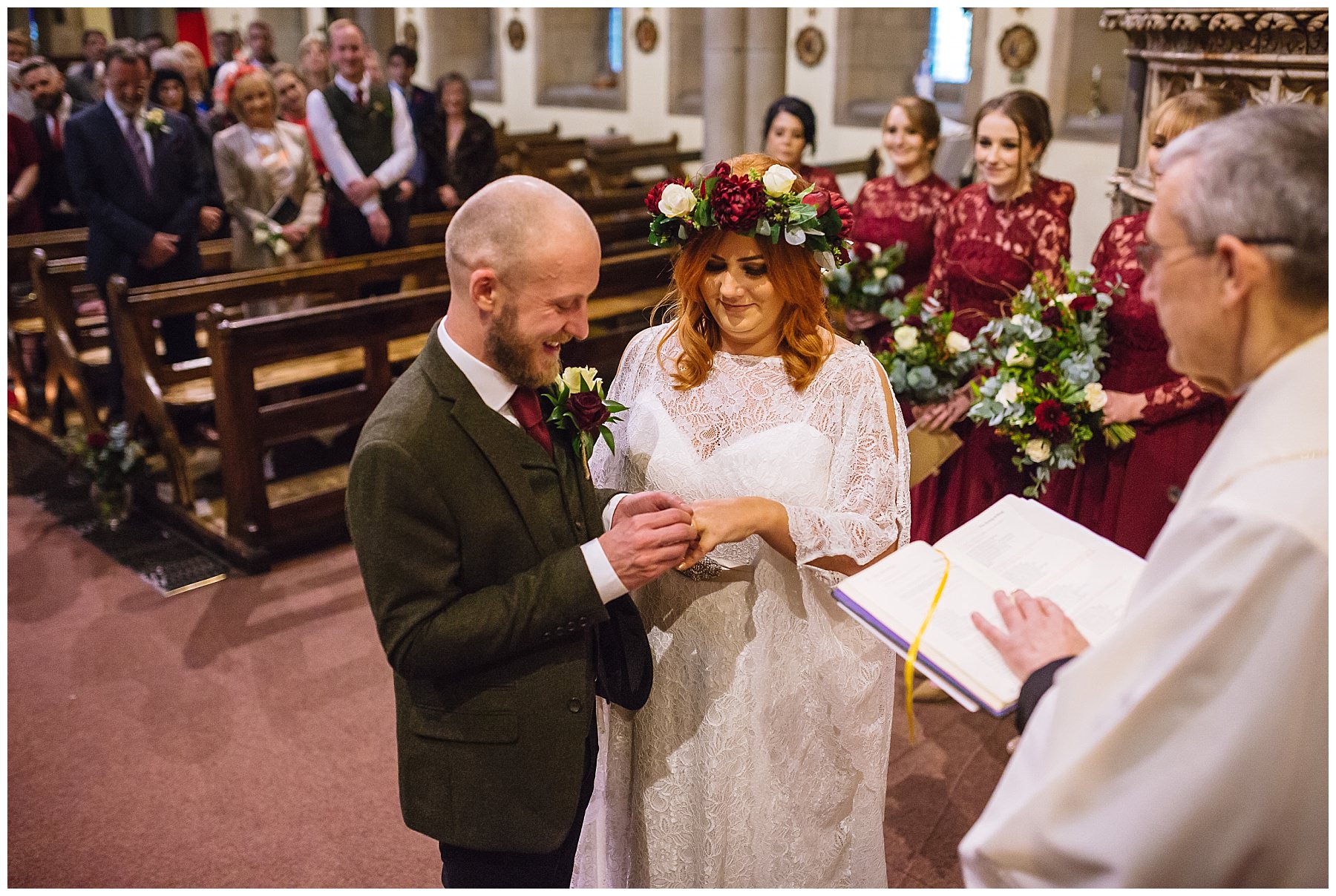bride and groom exchange wedding rings