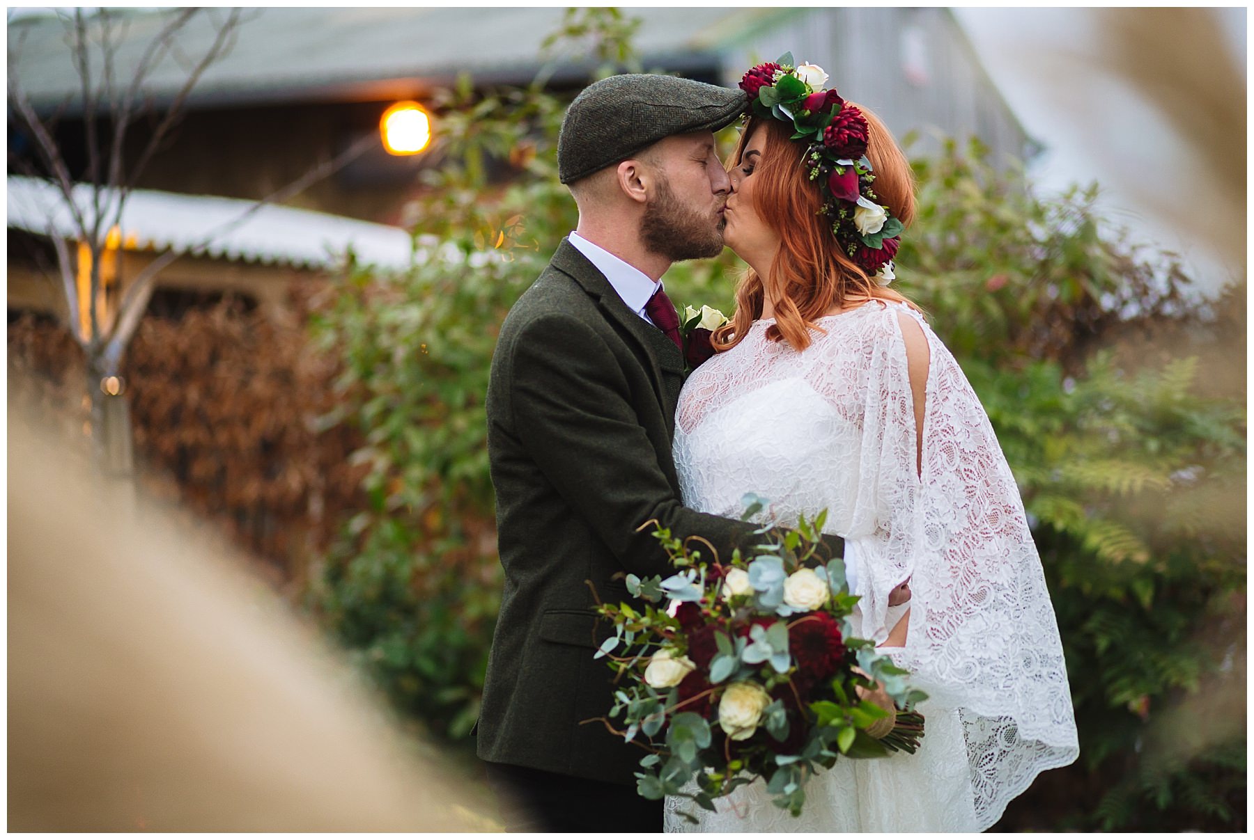 Bride and Groom Kiss by the pampas grass