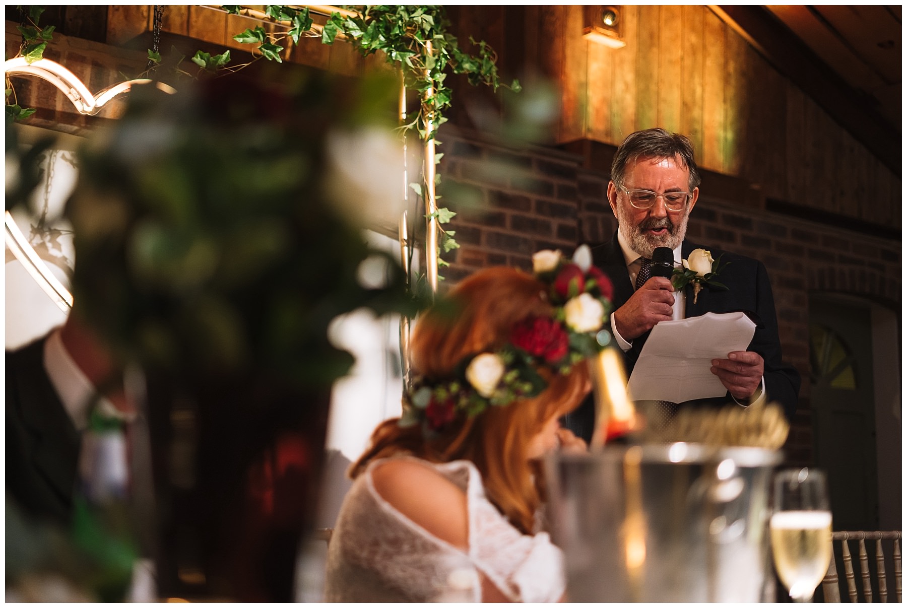 Father of the bride stands for his speech