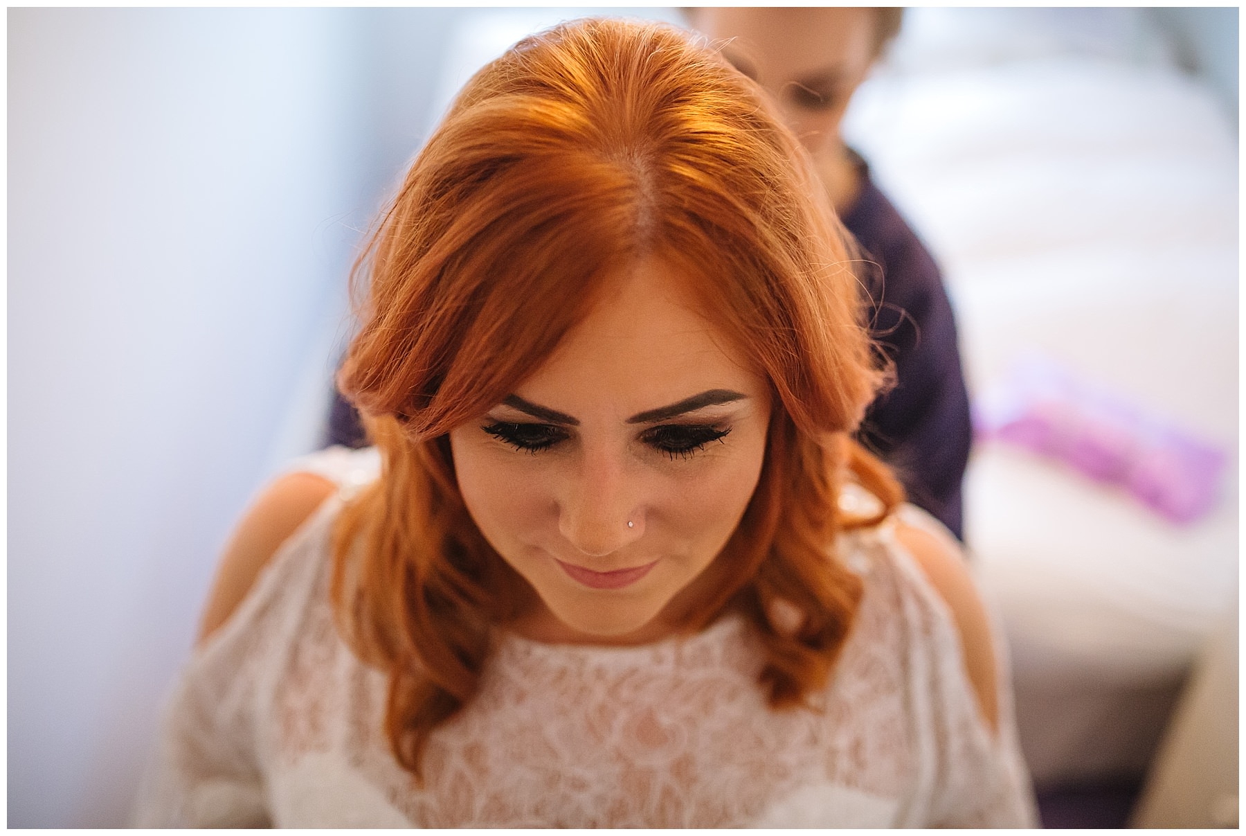 Bride gets into wedding dress