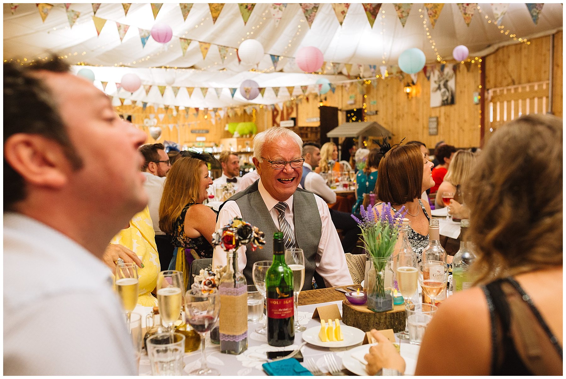 wedding guests laugh and react to speeches