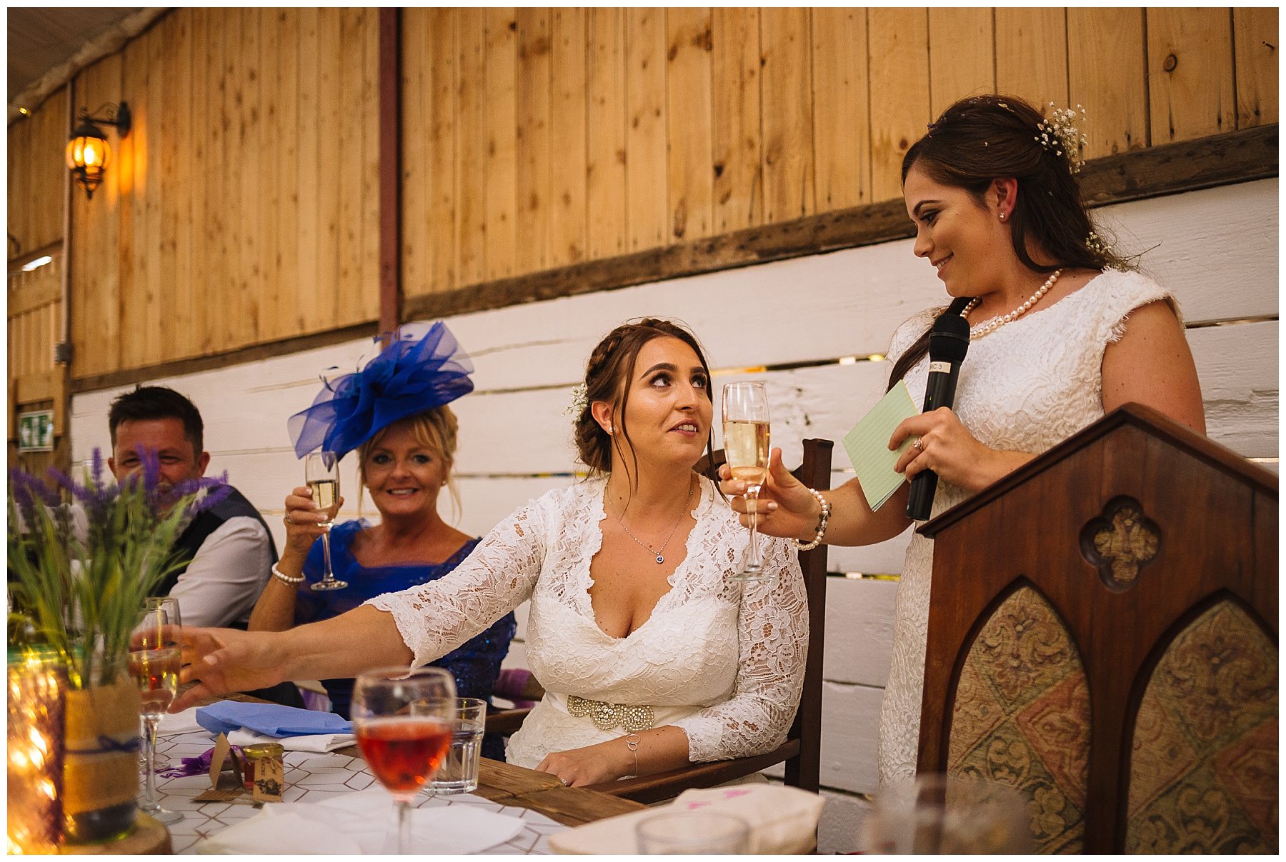brides share a toast at same sex wedding