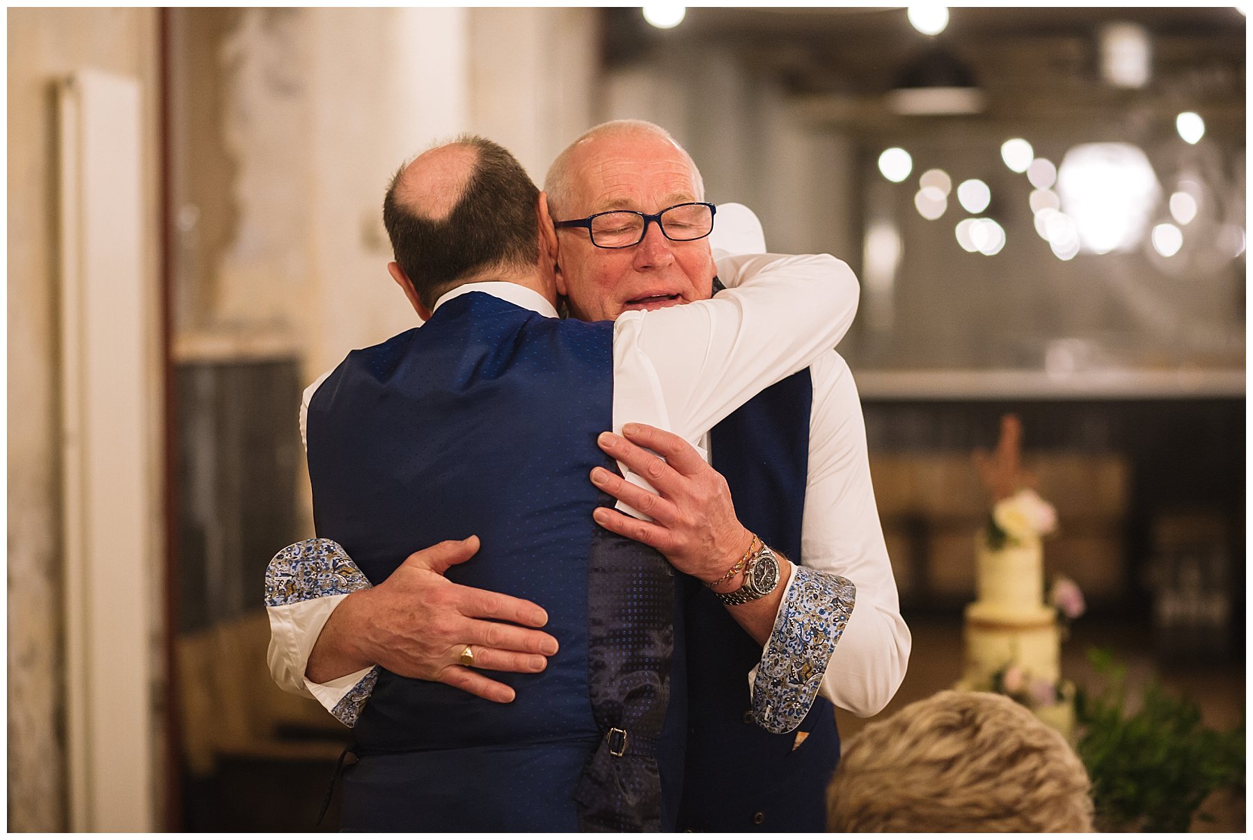 Emotional hug between groom and best man