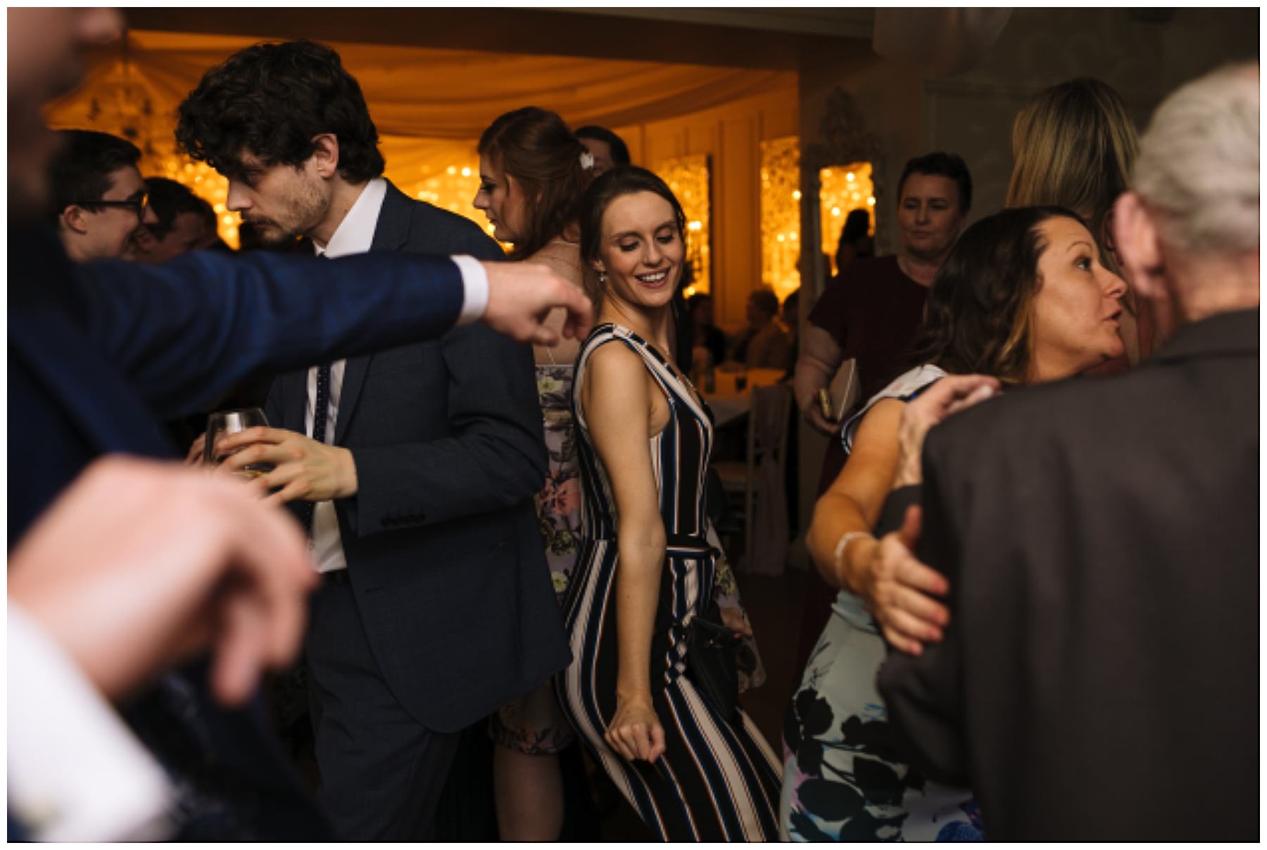 packed dance floor as guest enjoy eaves hall wedding
