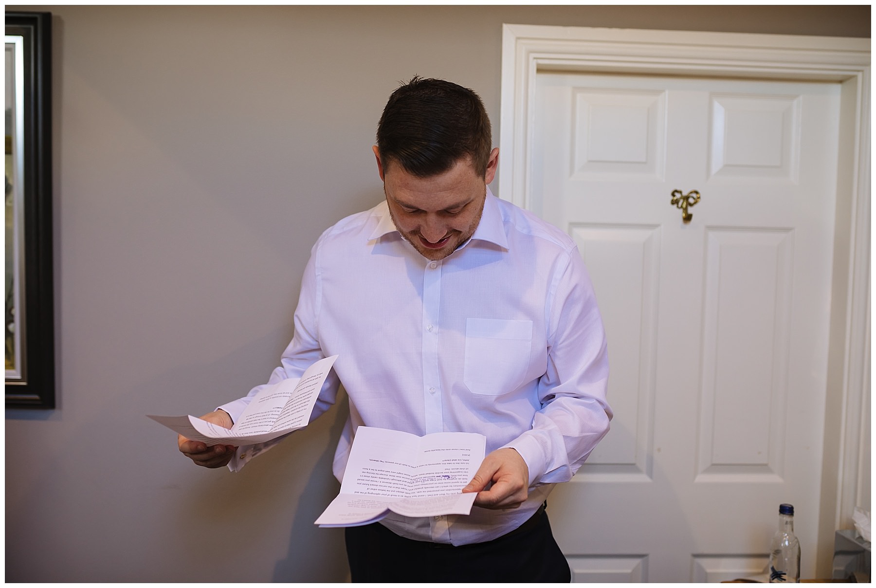 Groom checks his speech during prep