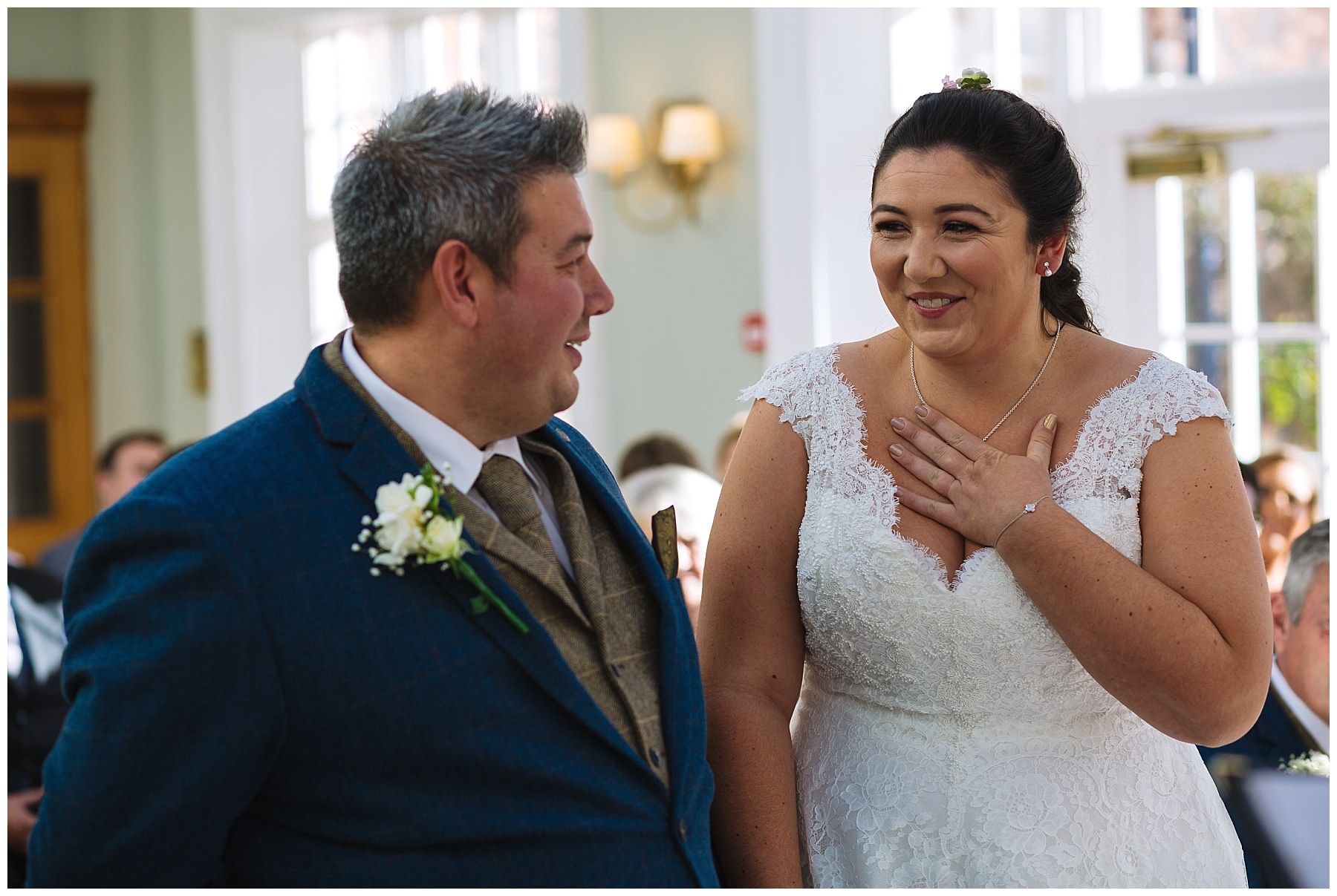 bride laughs during willington hall hotel wedding ceremony