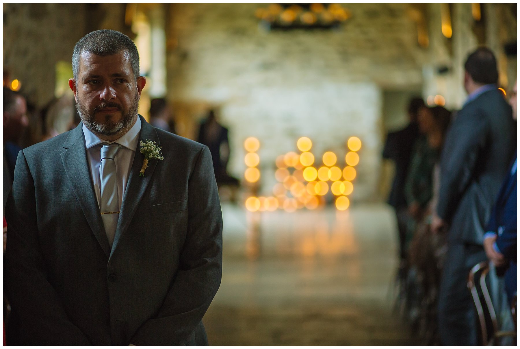groom in the banquet hall at healey barn