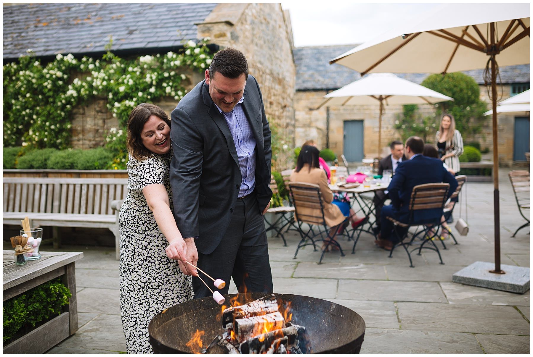 guests toast marshmallows over the fire pits at healey barn