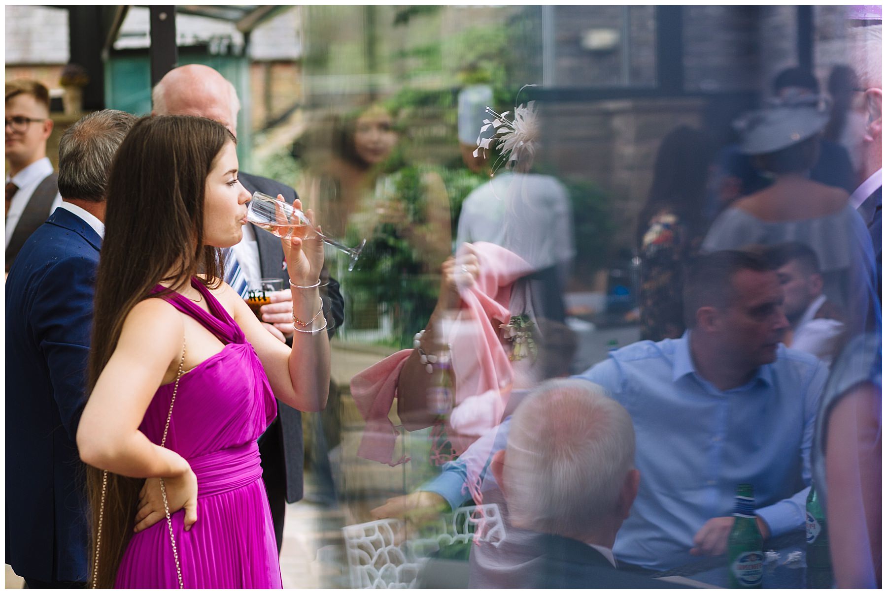 weding guest at rivington barn enjoying a drink