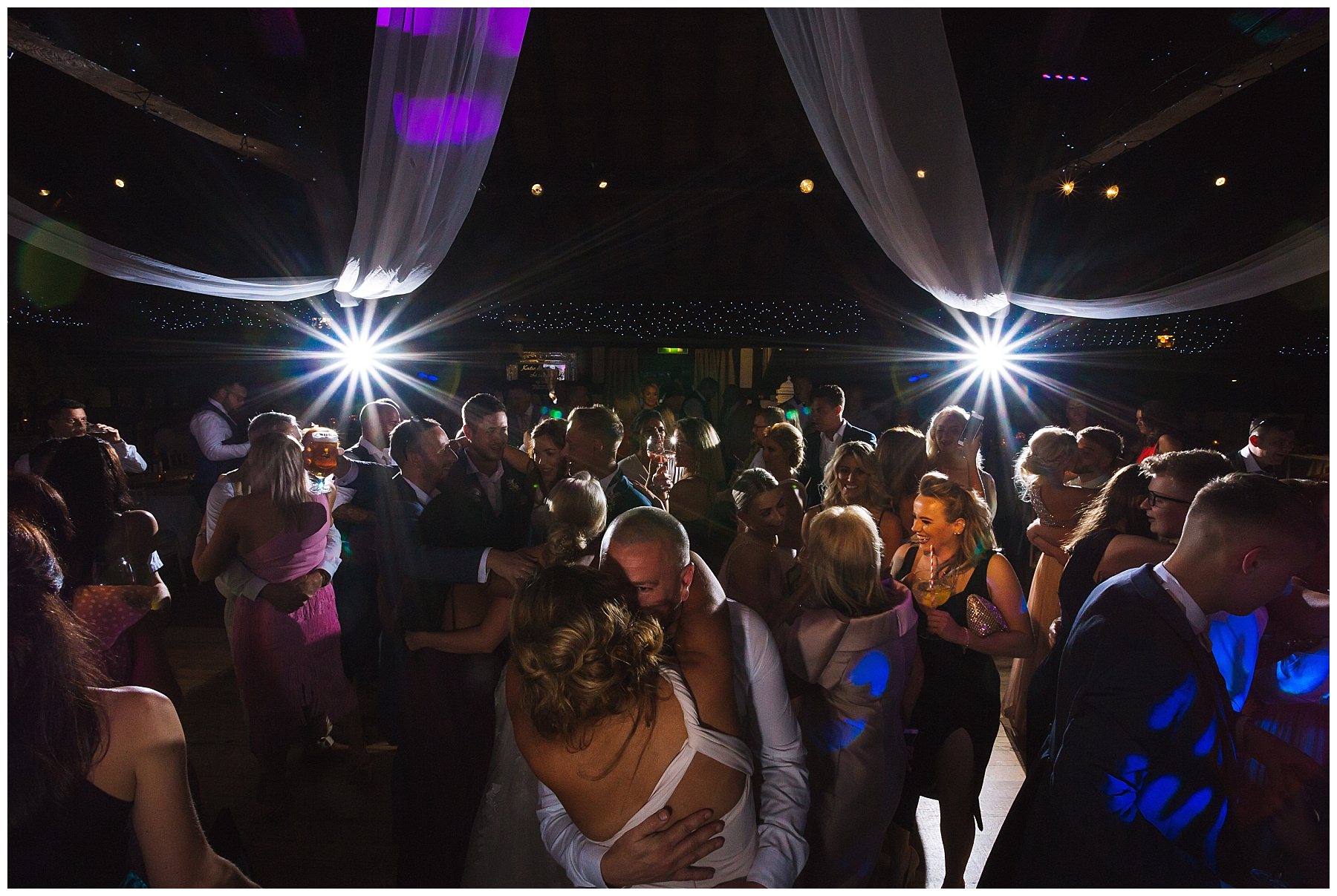 busy dance floor at rivington hall barn wedding