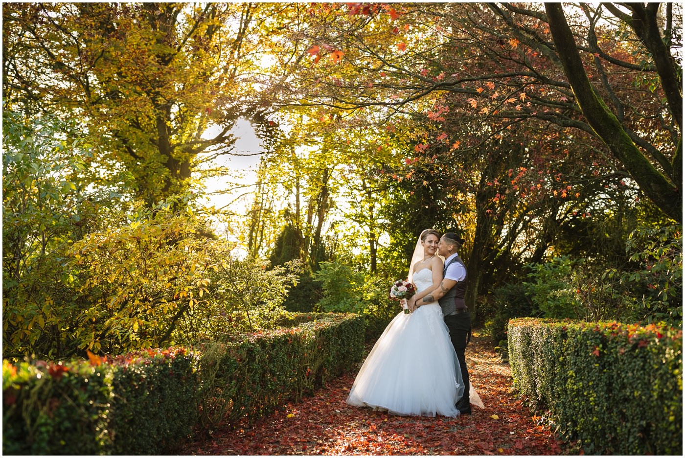 Same sex couple in the beautiful grounds at eaves hall