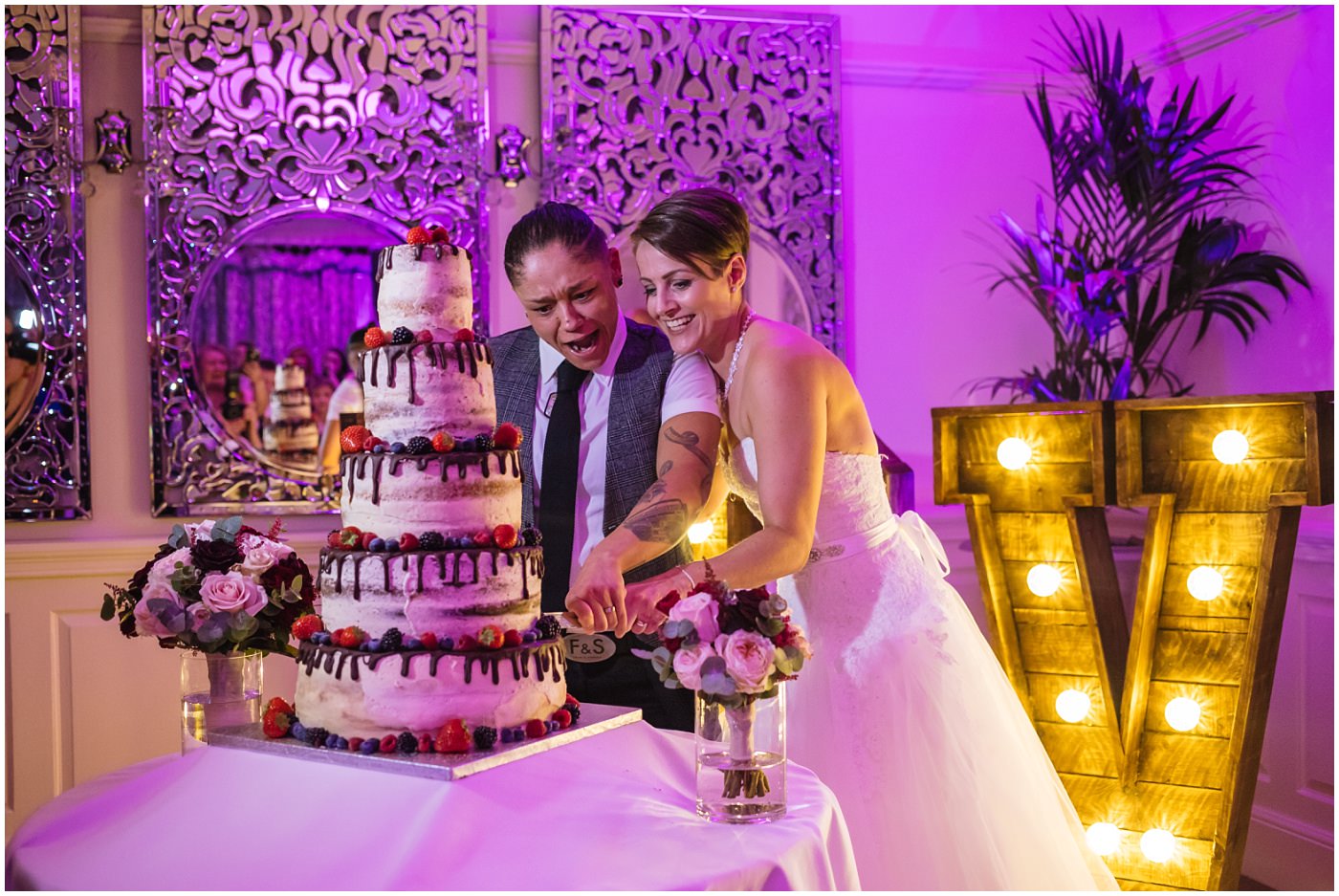 Wedding cake cut at eaves hall