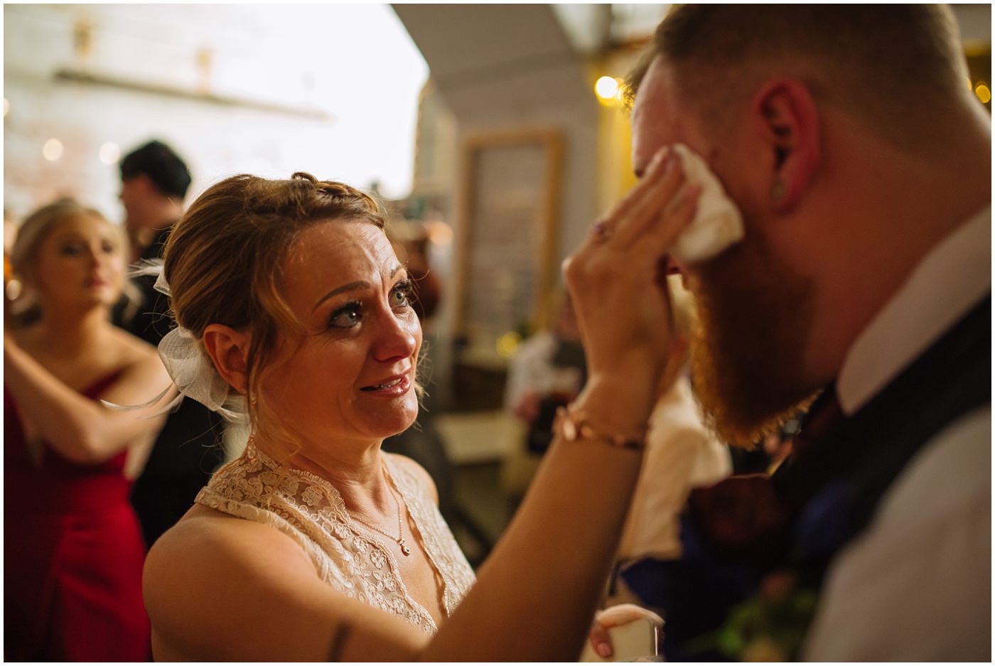 Mum wipes tears from son at manchester wedding