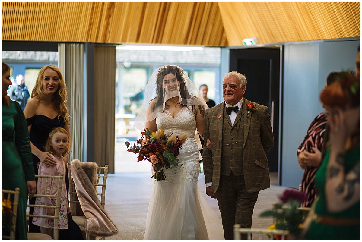 Bride arrives for autumnal wedding at Brockholes Nature Reserve