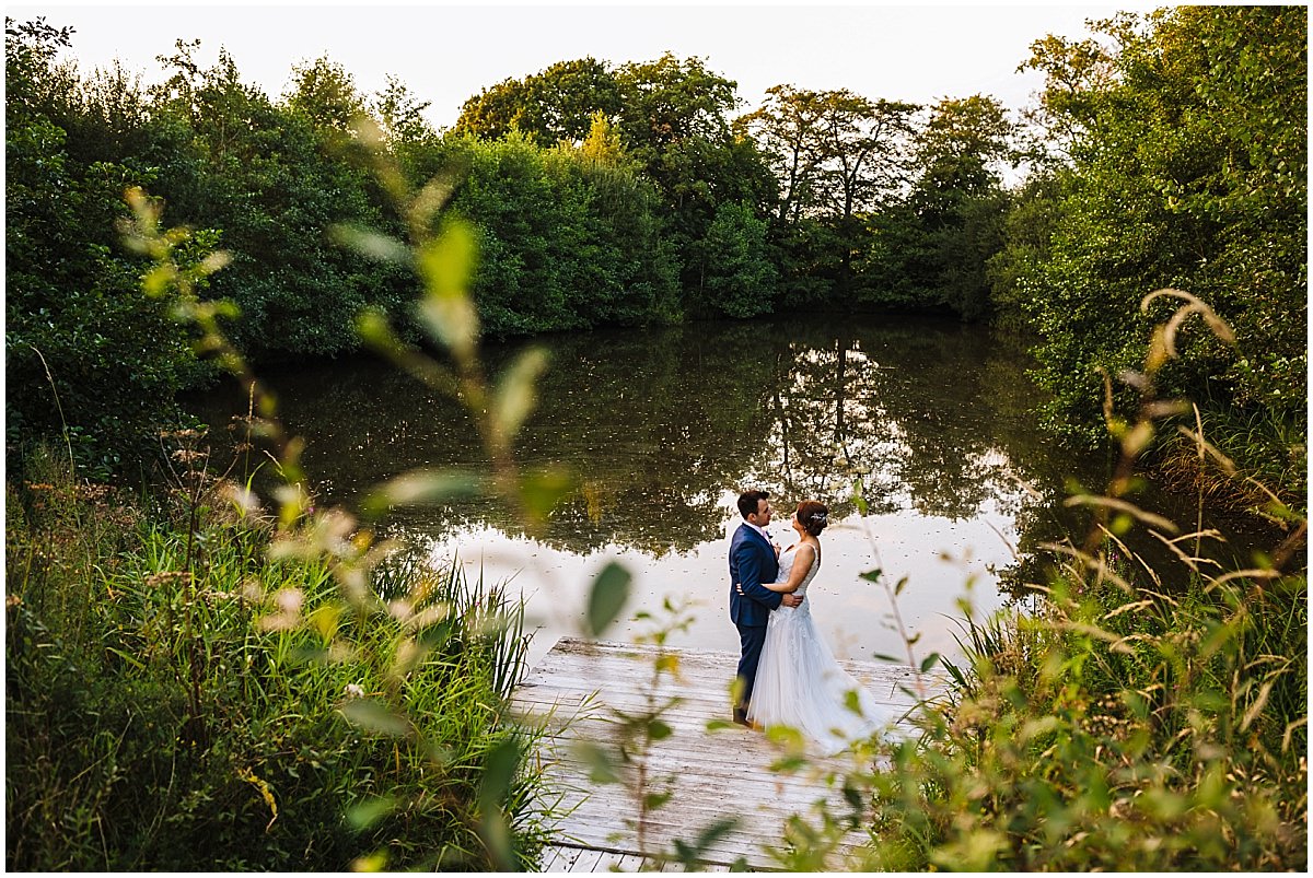 The stunning lake at styal lodge is perfect for wedding pictures