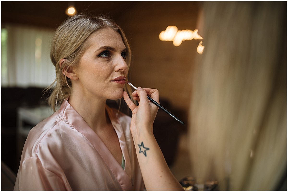 Bridesmaid has her make up finished off at styal lodge