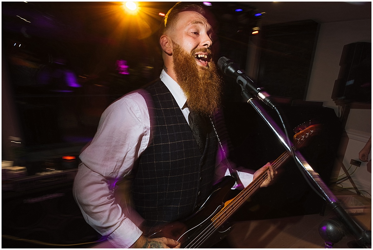 best man gets up and plays with wedding band