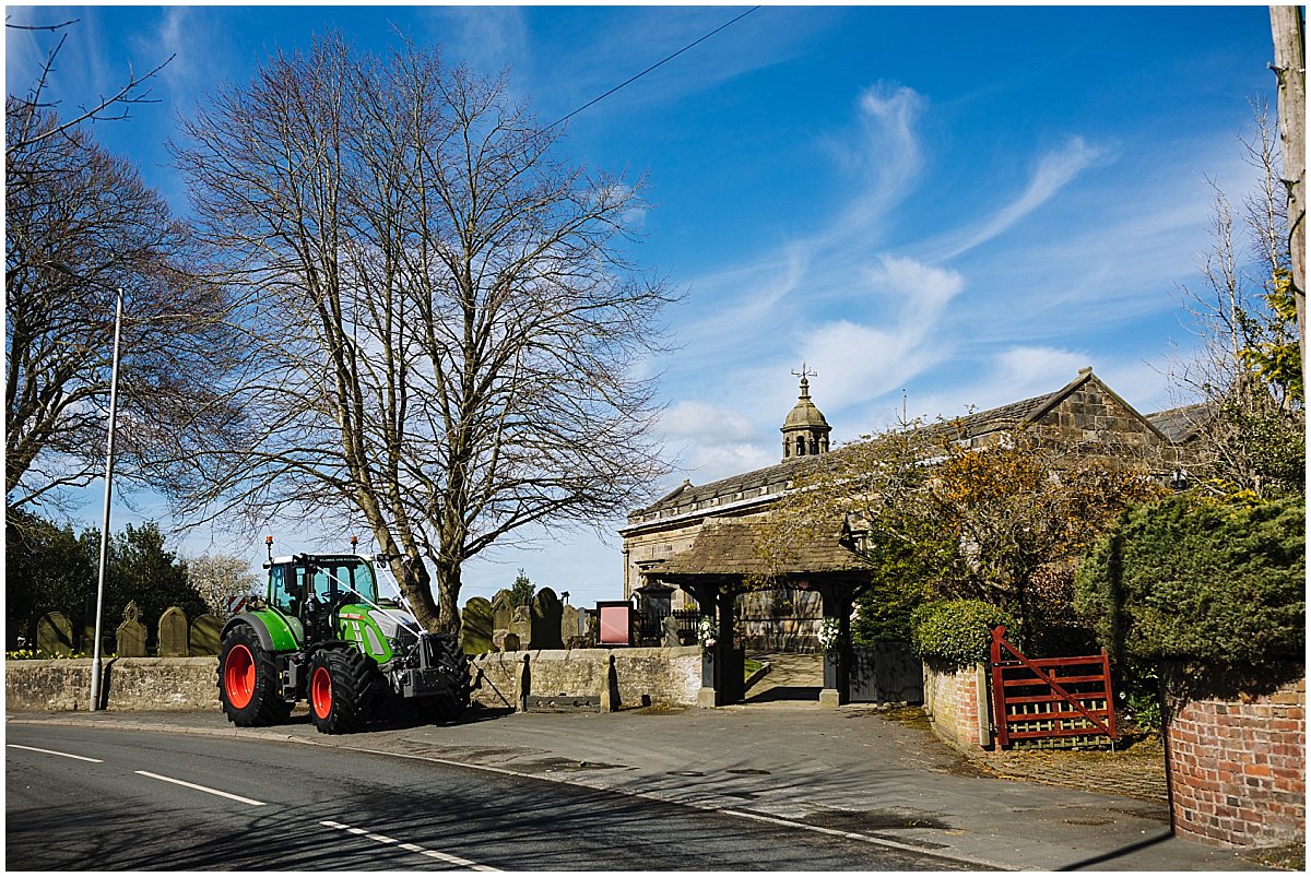 Wedding tractor parked outside the church