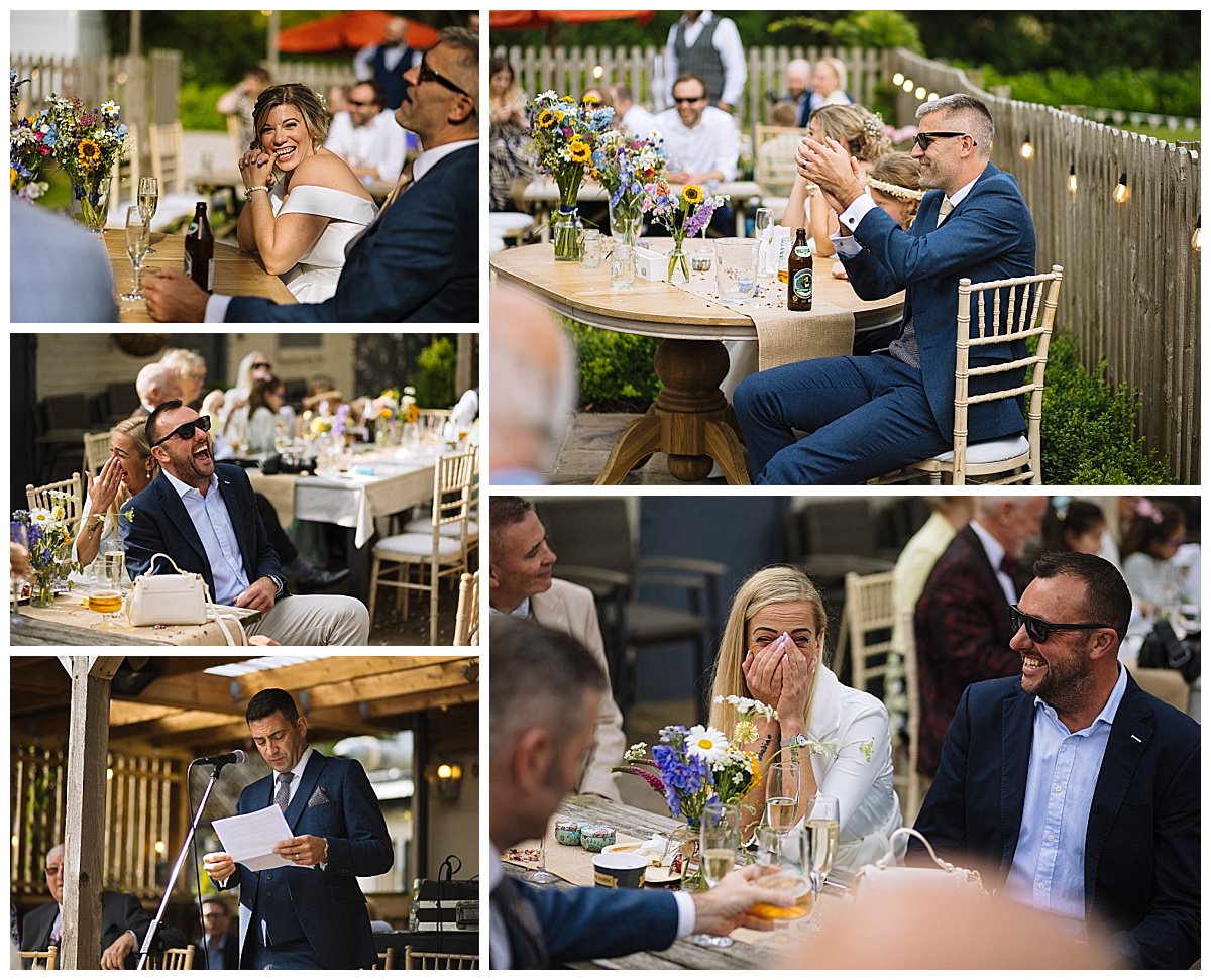 Guests enjoying laughter and heartfelt speeches during a lively outdoor wedding reception, surrounded by flowers and cheerful decor.