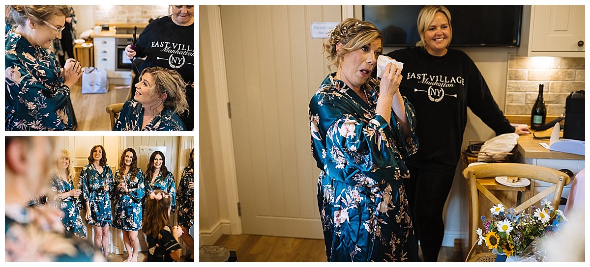 A joyful bridal party celebrating together in matching floral robes, capturing a candid moment of laughter and emotion.